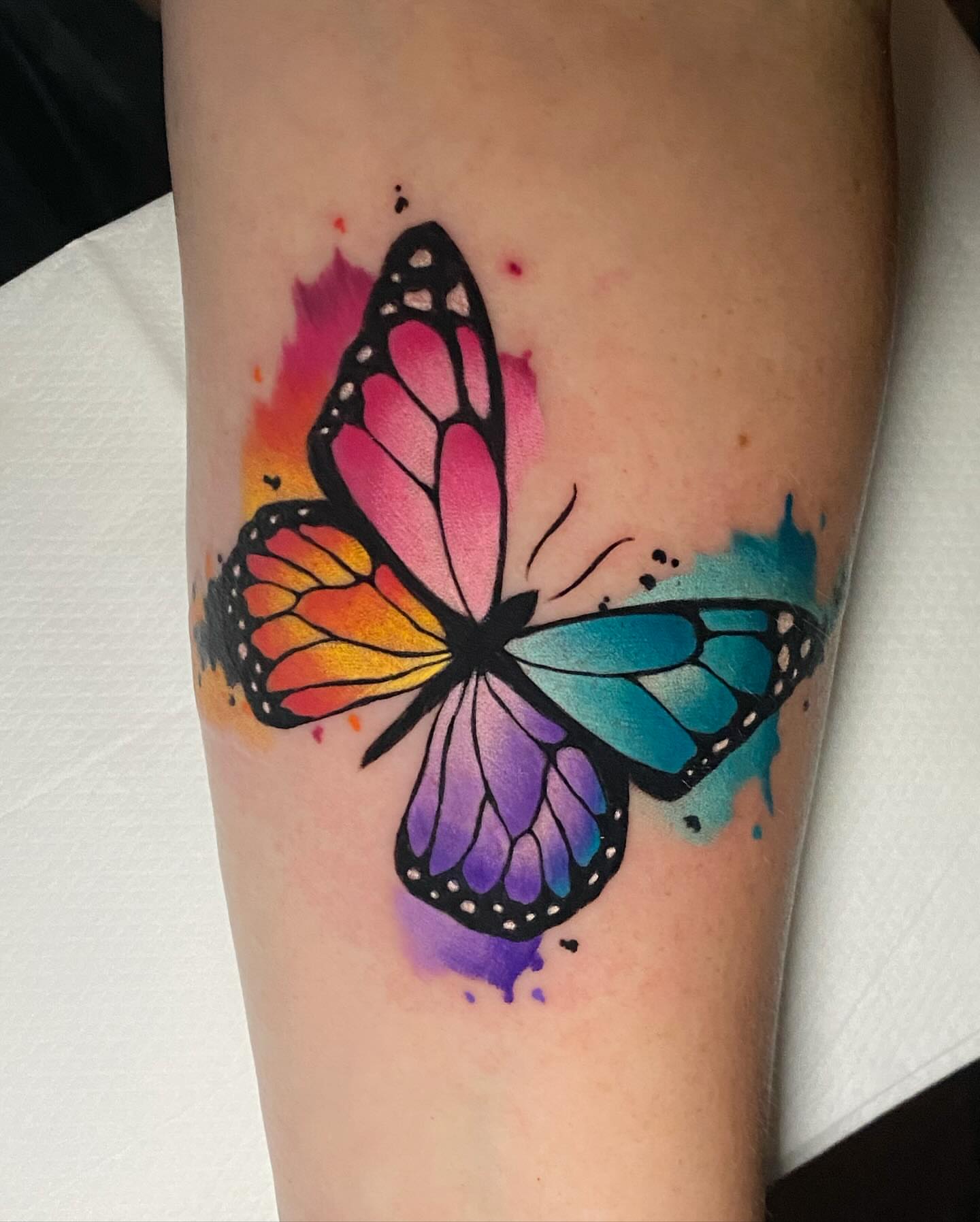 Butterfly watercolor tattoo on the forearm by Bruce becerra tattoos