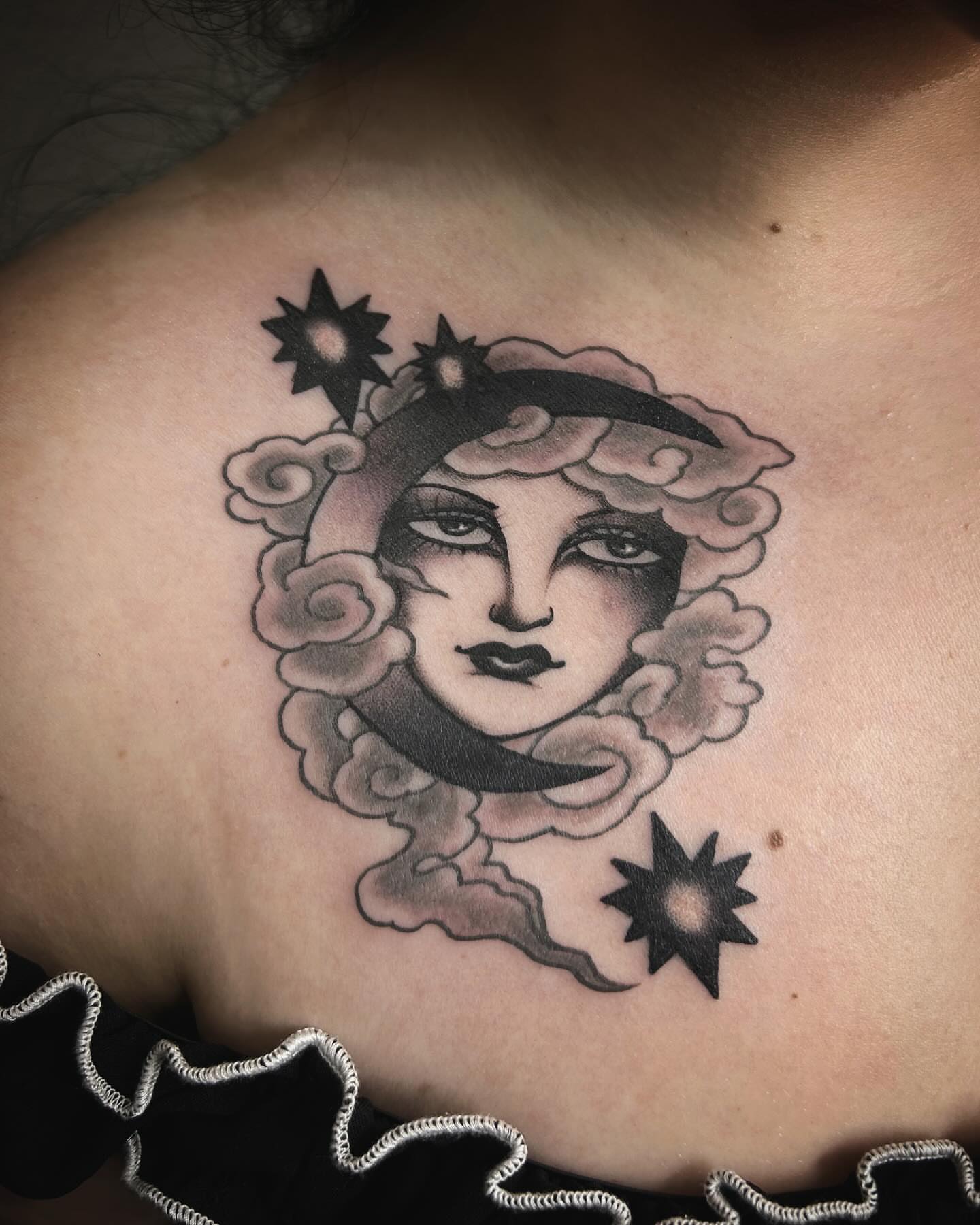 Moon and cloud black and grey tattoo on the chest by Samantha C, Bremerton, Washington