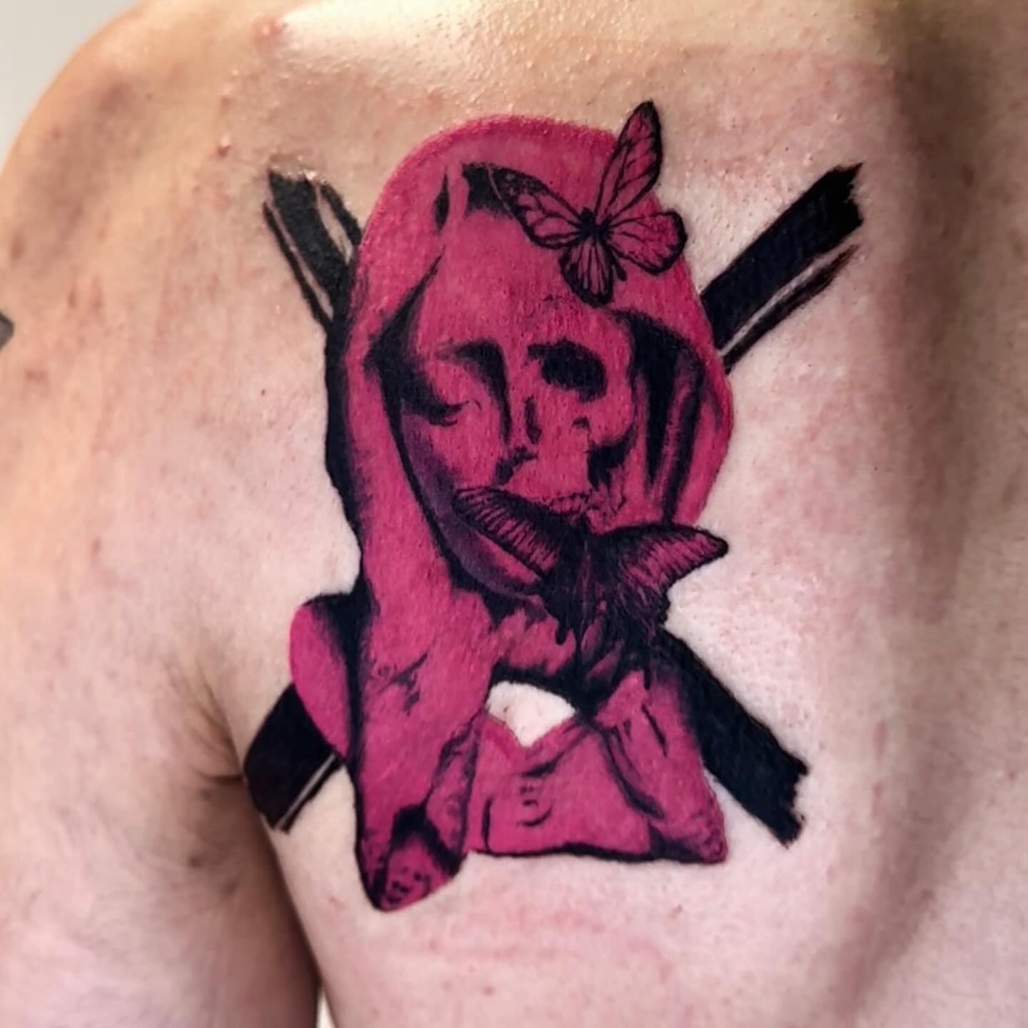 Red hooded figure neo-traditional tattoo on the shoulder by Bennie Bae