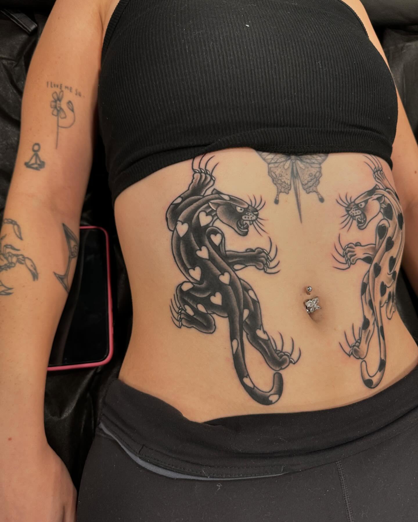 Panthers black and grey tattoo on the torso by Jay Espinoza-AZ Tattooer