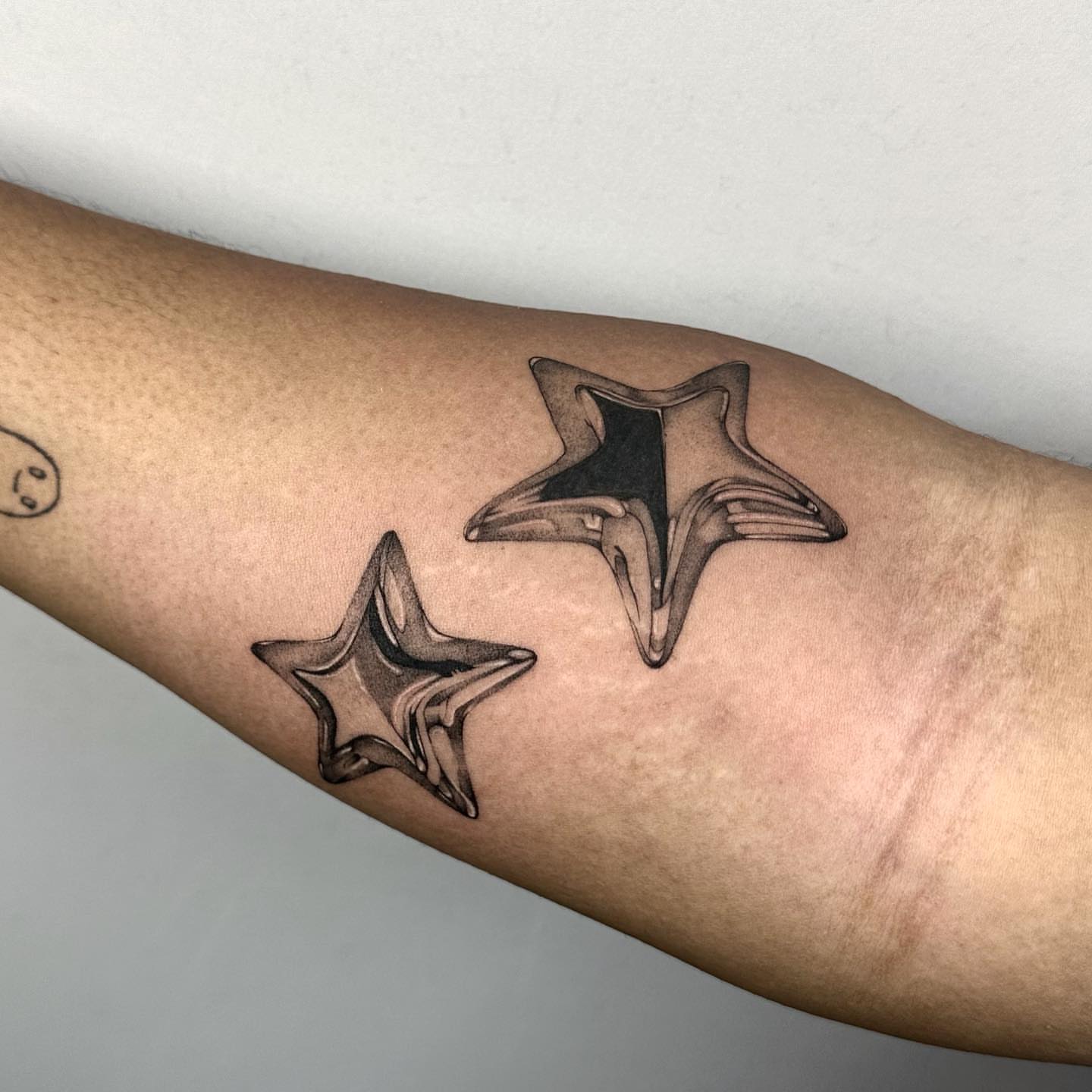 Stars black and grey tattoo on the forearm by ๐๐๐๐ ๐๐๐๐
