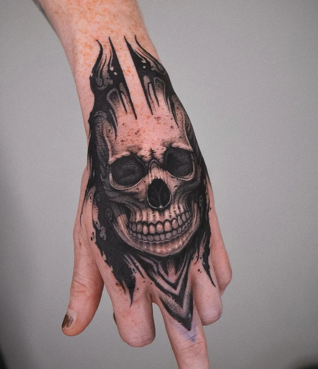 Skull dark realism tattoo on the hand by Minho