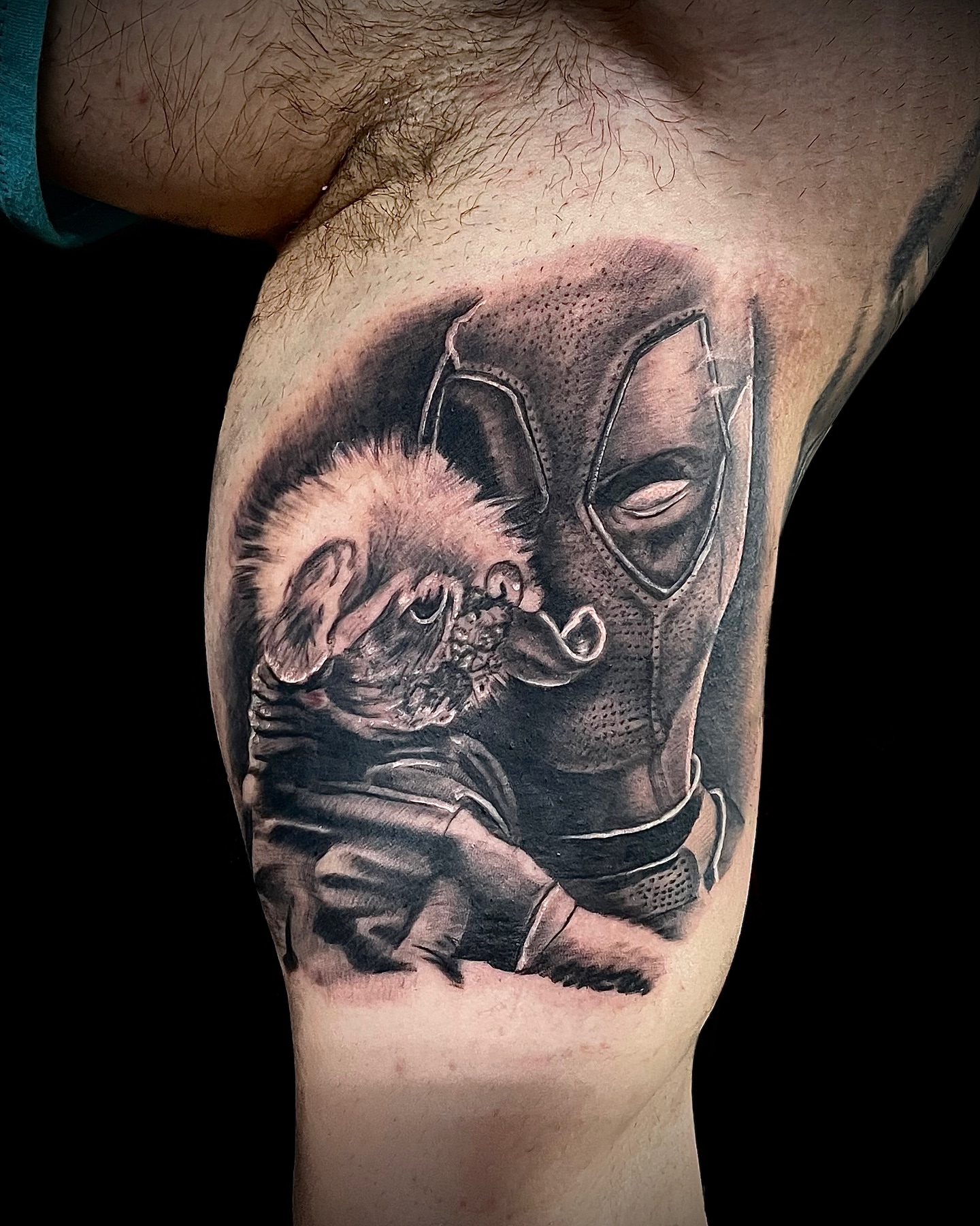 Deadpool hugging baby realism tattoo on the chest by Nick Harrison, Dayton, Ohio