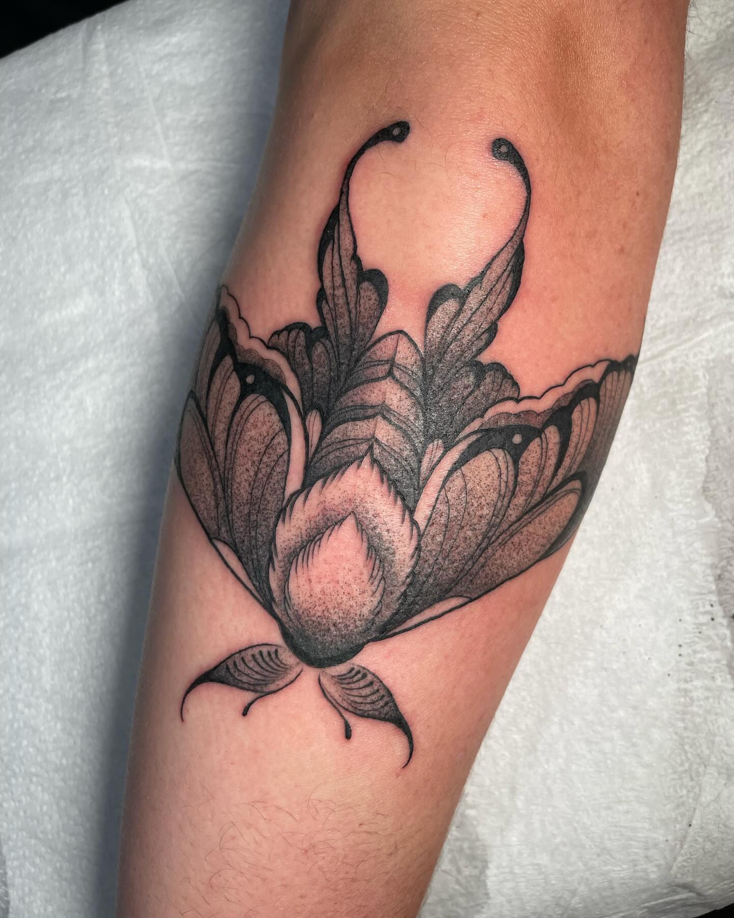 Peony dotwork tattoo on the forearm by Tayler Beetison