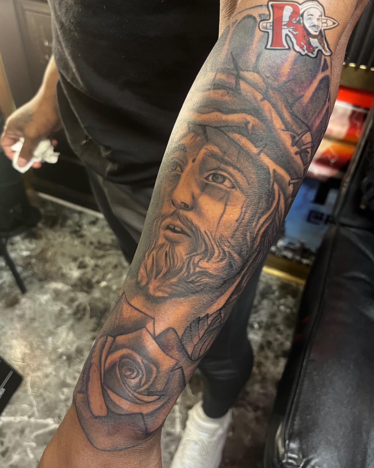 Religious figure with crown of thorns realism tattoo on the forearm by Chicago Tattoo Artist