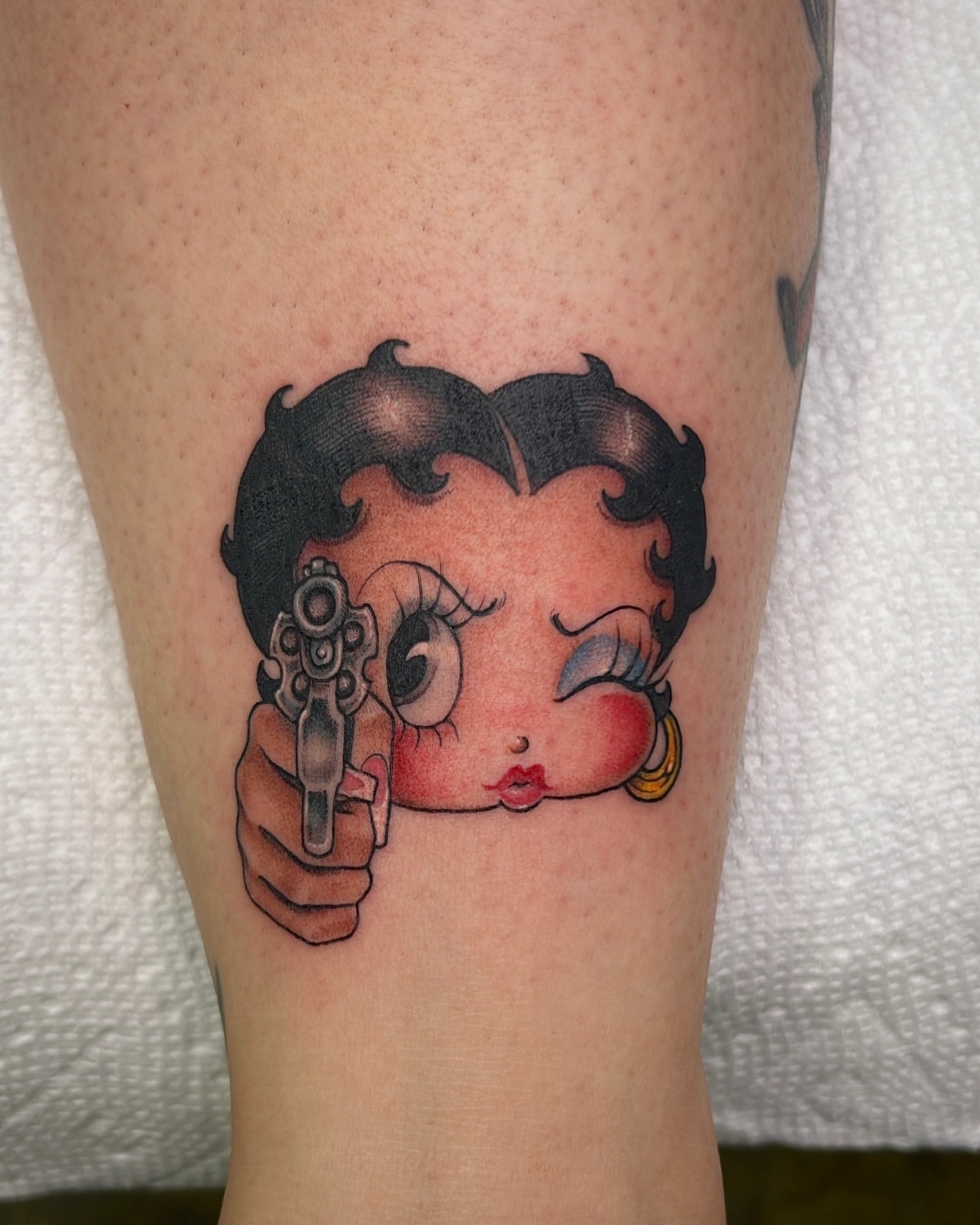 Betty Boop American traditional tattoo on the forearm by Valerie Dominguez