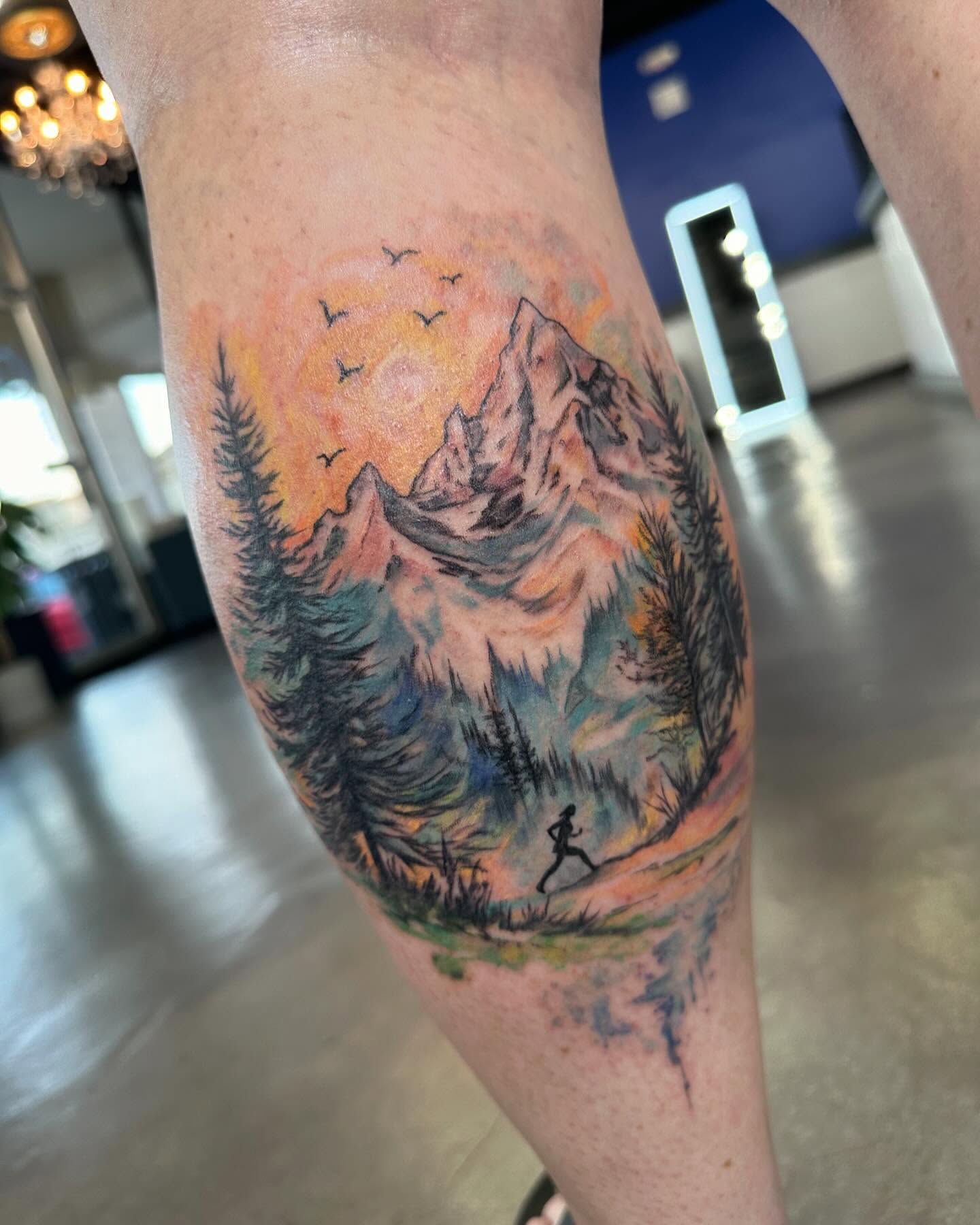 Mountain landscape watercolor tattoo on the forearm by Cameron Hobbs, Woodbridge, Virginia