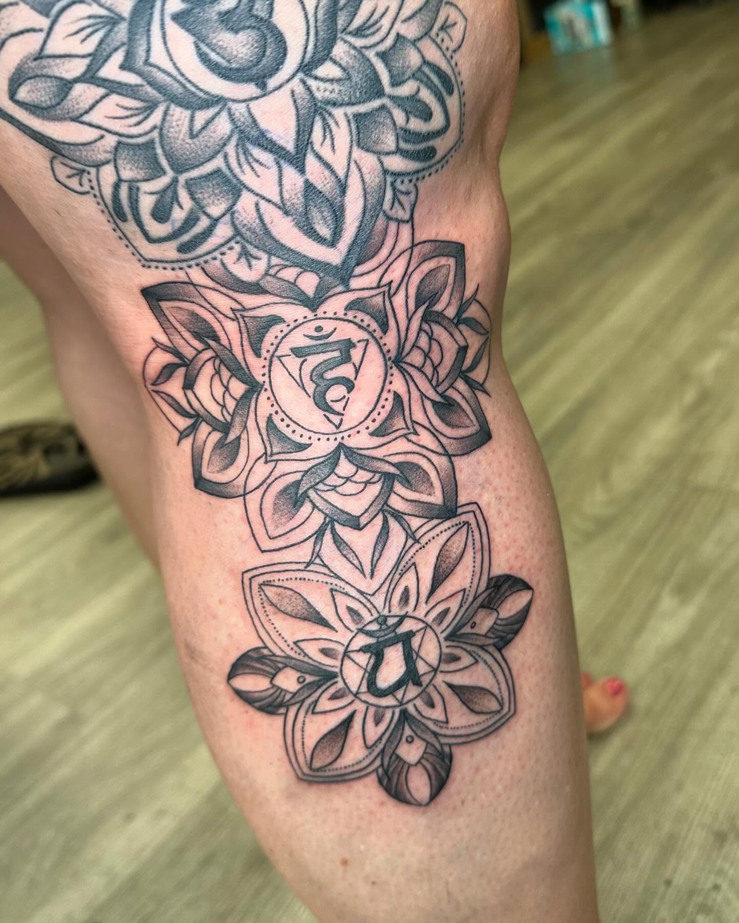 Lotus flower geometric tattoo on the thigh by hannah vertal