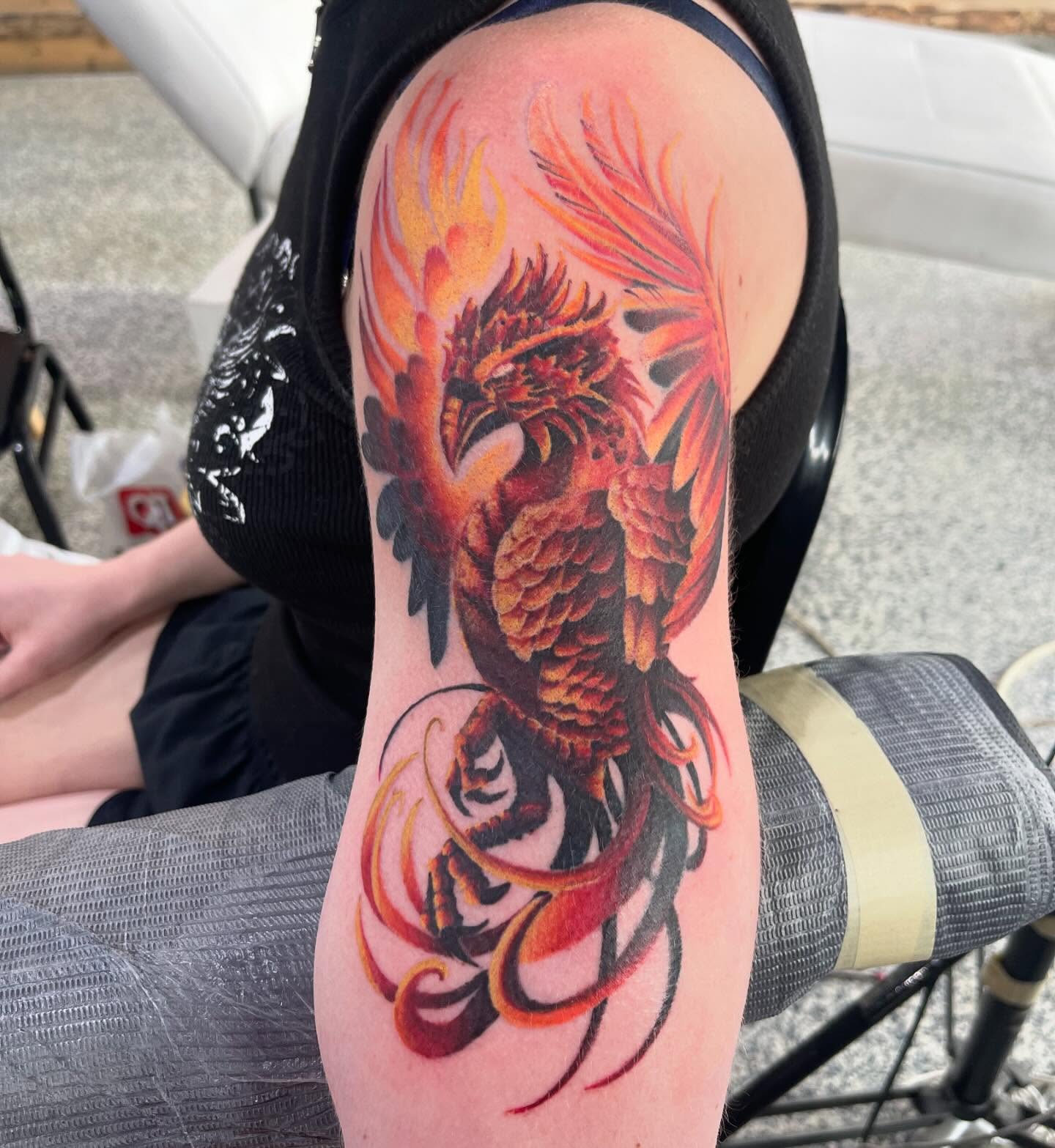 Phoenix neo-traditional tattoo on the forearm by Troy Butner