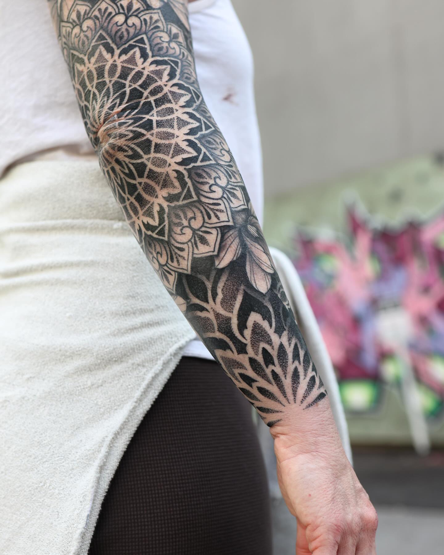 Geometric pattern geometric tattoo on the forearm by Laure Conzales