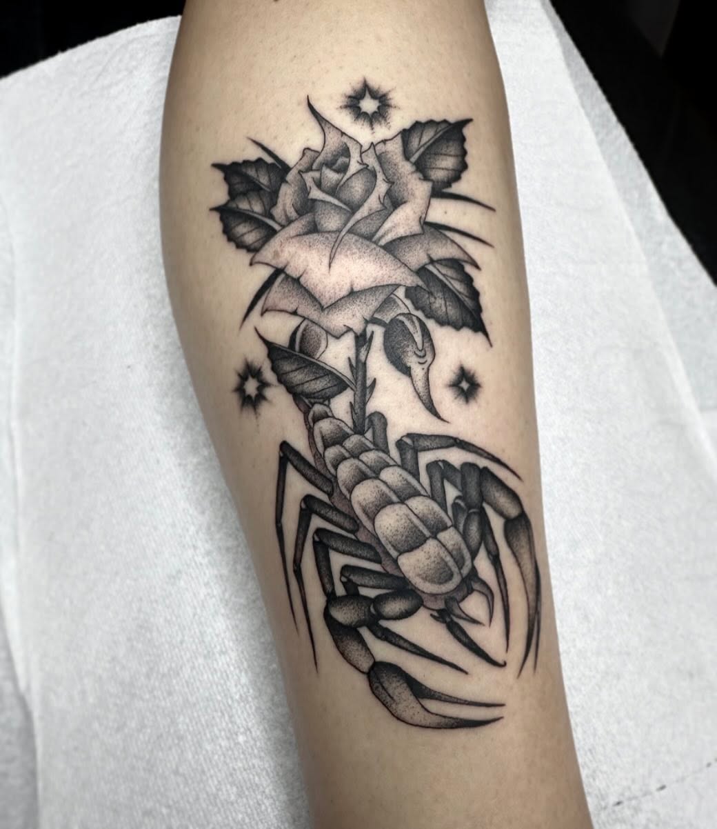 Scorpion and rose realism tattoo on the forearm by Elijah Edwards