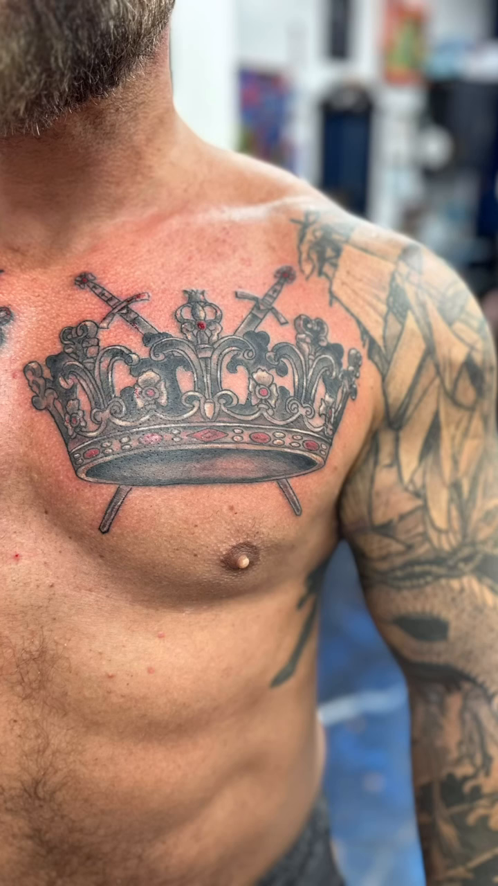 Crown with swords realism tattoo on the chest by Christian Colón, Nashville, Tennessee