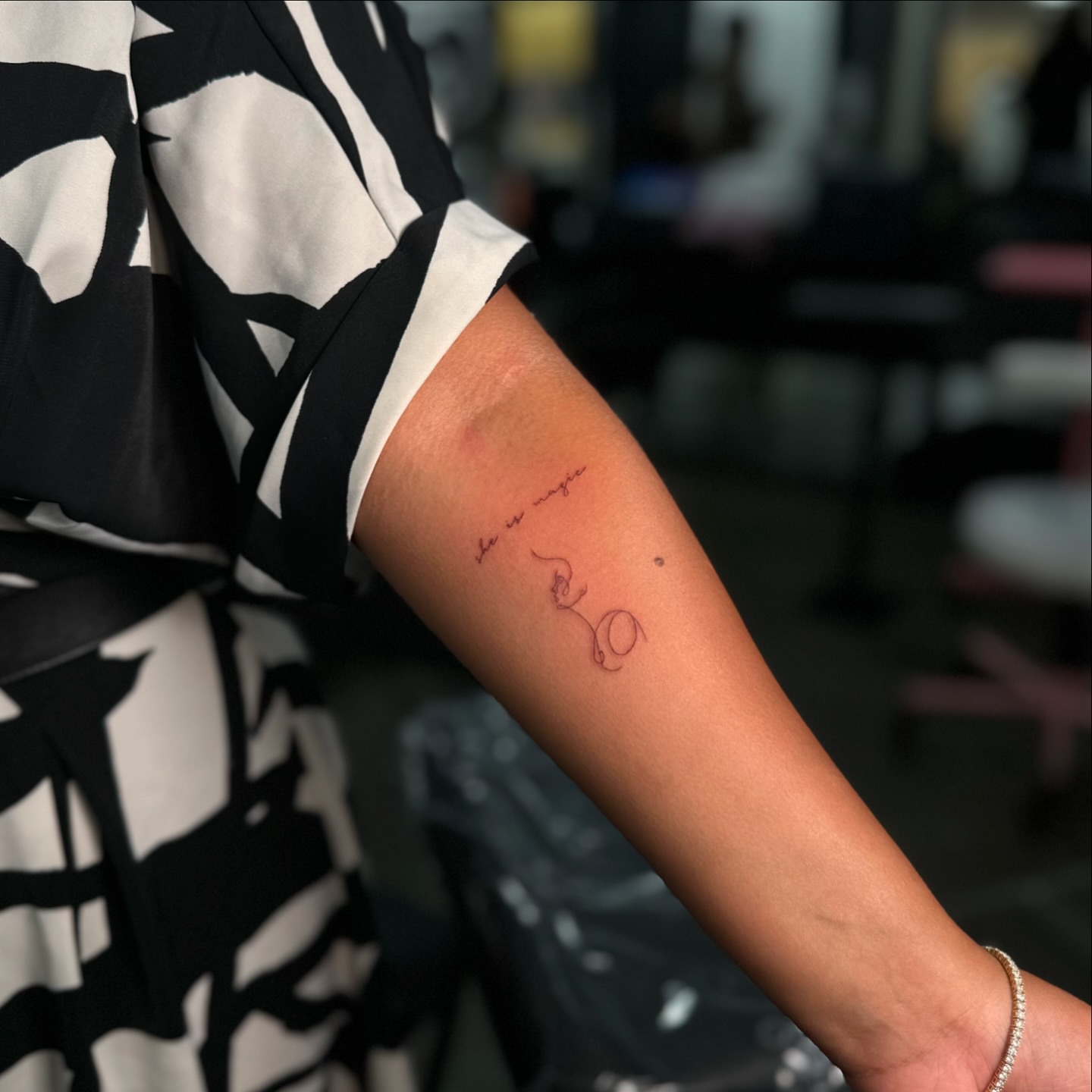 Snake and cursive text fine line tattoo on the forearm by Yaya Tattoos ✩ Fine Line Tattoos