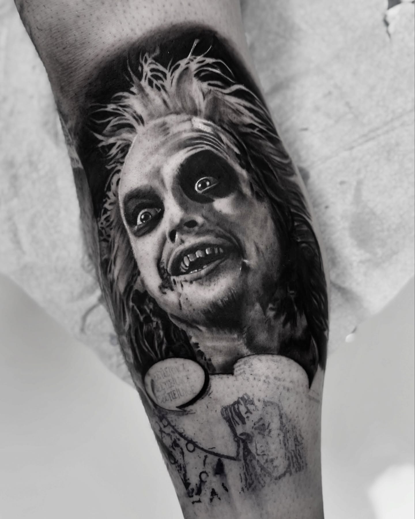 Beetlejuice realism tattoo on the forearm by Anthony Macias