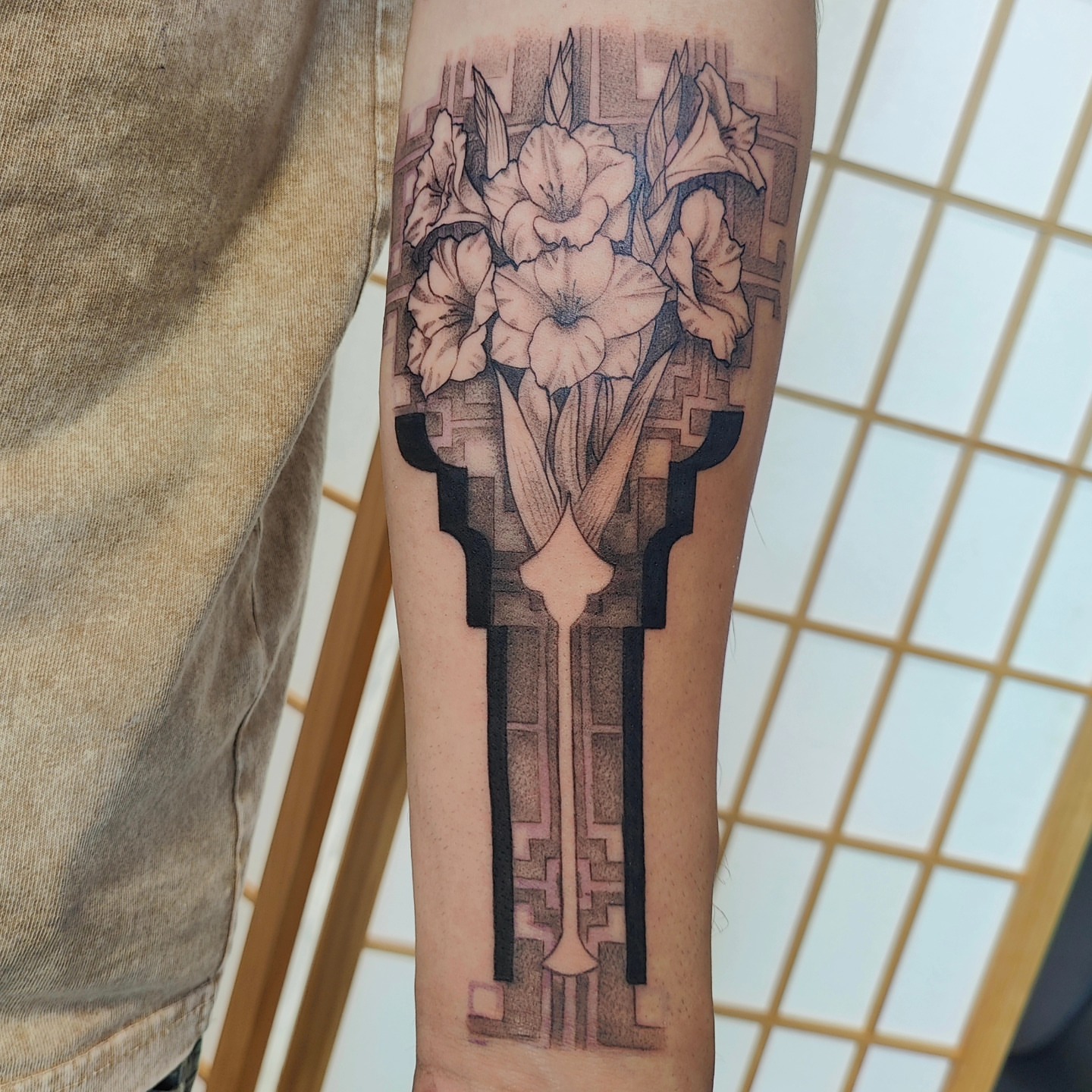 Gladiolus bouquet geometric tattoo on the forearm by Ｔｏｍ Ｌｏｒａｎｚ