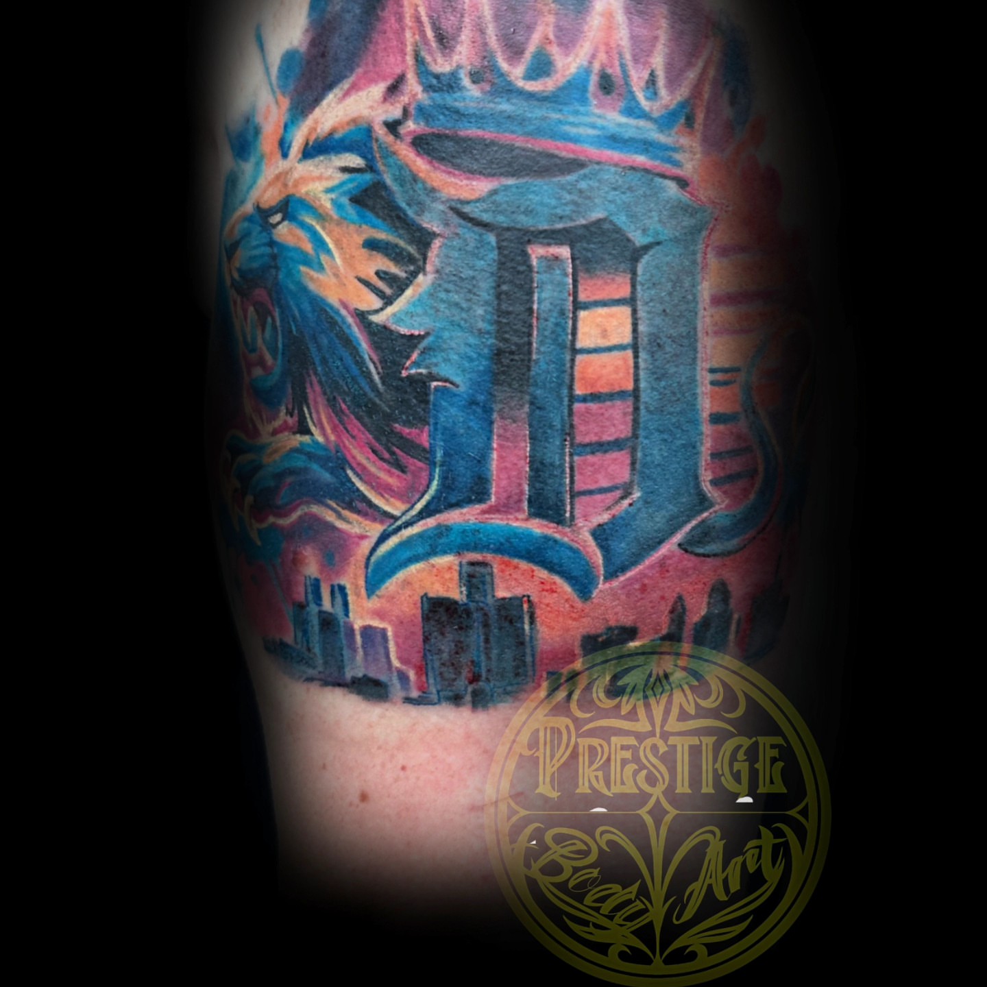 Lion and crown new school tattoo on the forearm by Shawn Cook