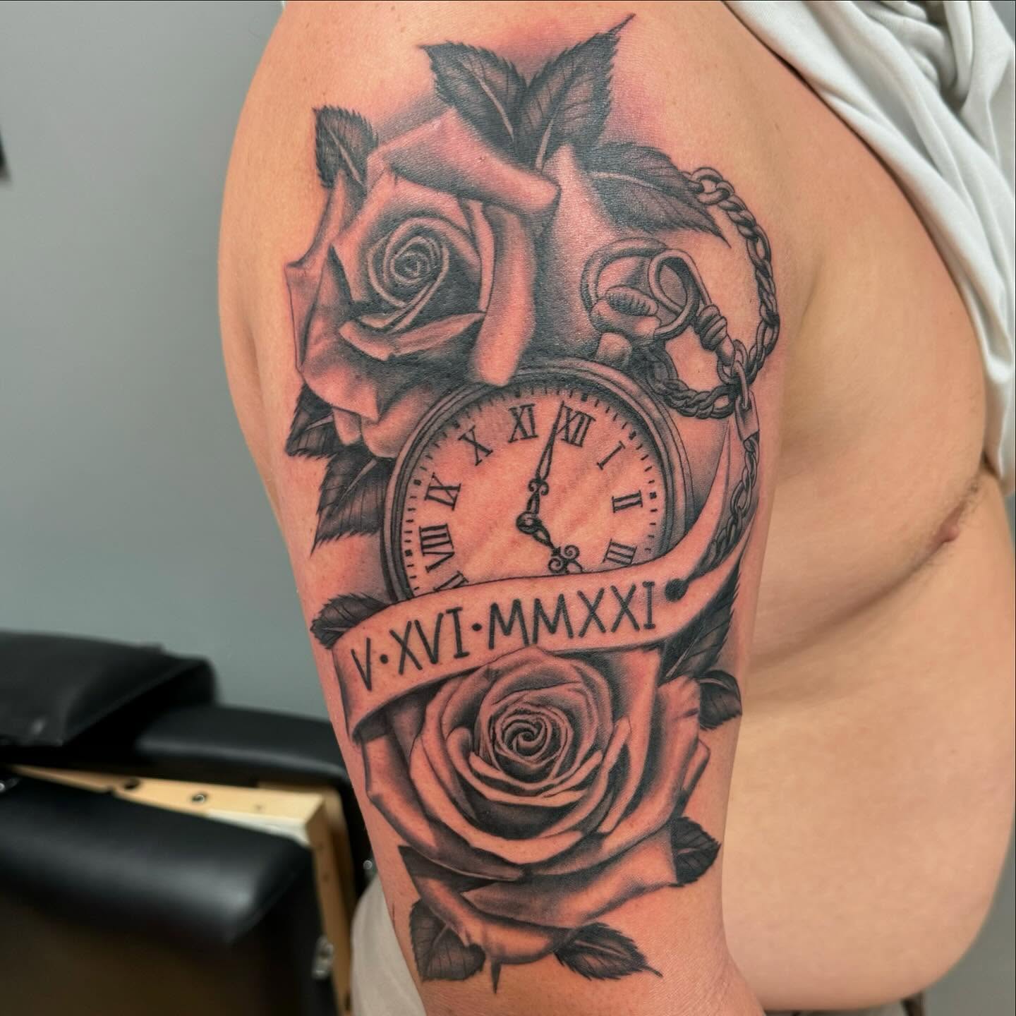 Clock and roses realism tattoo on the forearm by David Gottschalk