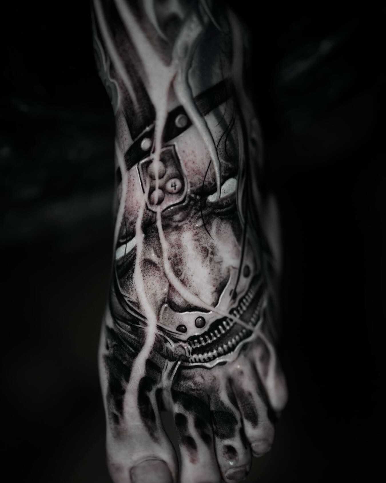 Mechanical face realism tattoo on the foot by Victor Portugal Tattoo