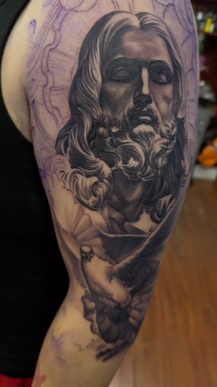 Jesus Christ with a dove realism tattoo by TATTOOS by Elvis Ramos - California tattoo