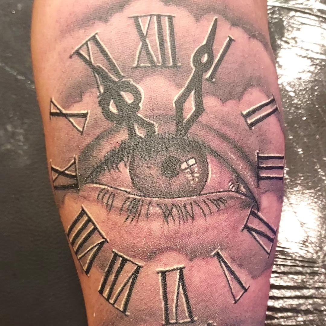 Clock black and grey tattoo on the forearm by Dave Johnson, Billings, Montana