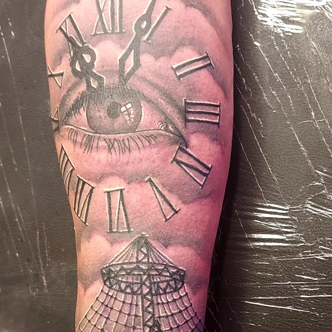 Eye and clock realism tattoo on the forearm by Dave Johnson, Billings, Montana
