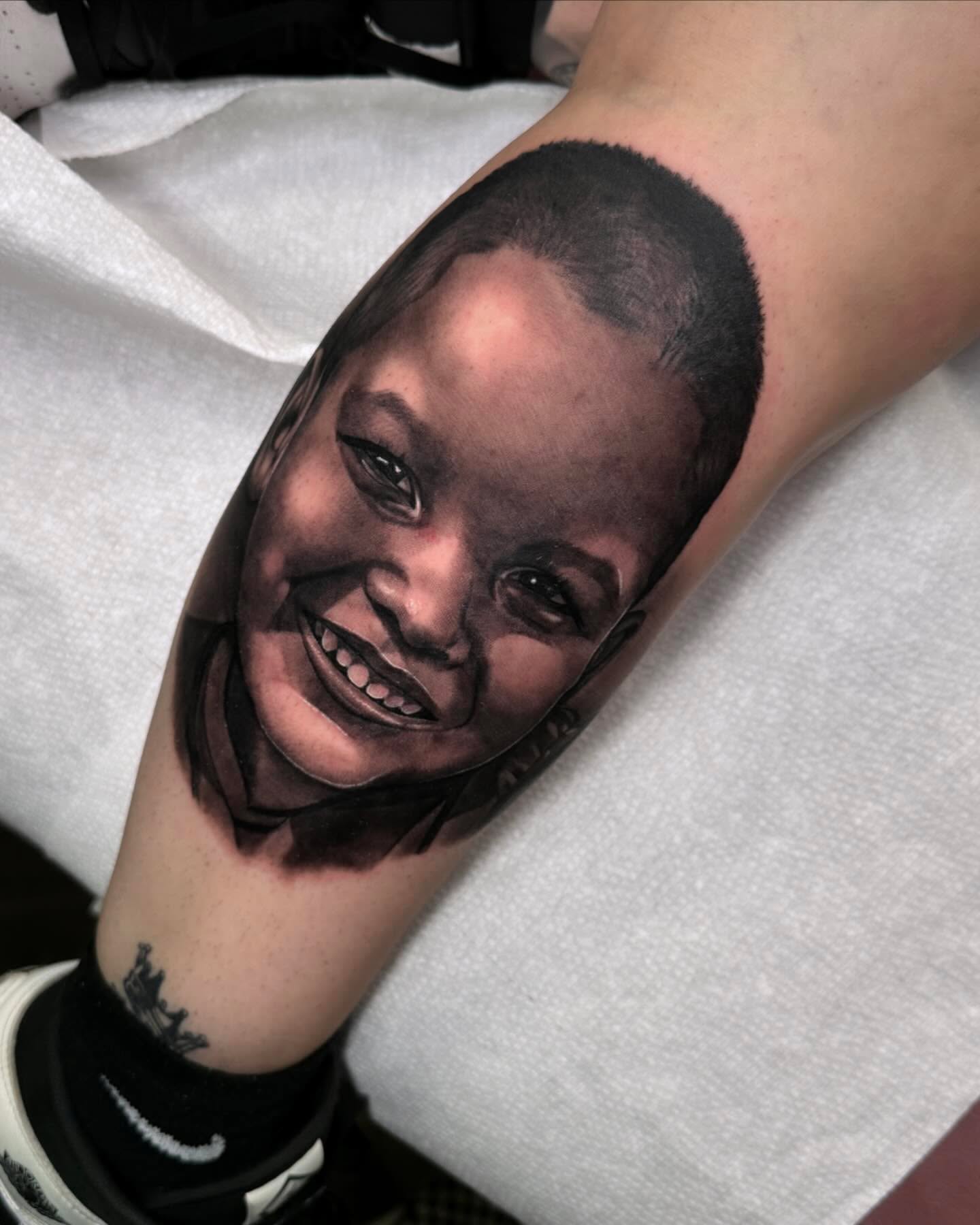 Portrait realism tattoo on the forearm by Anthony Duran