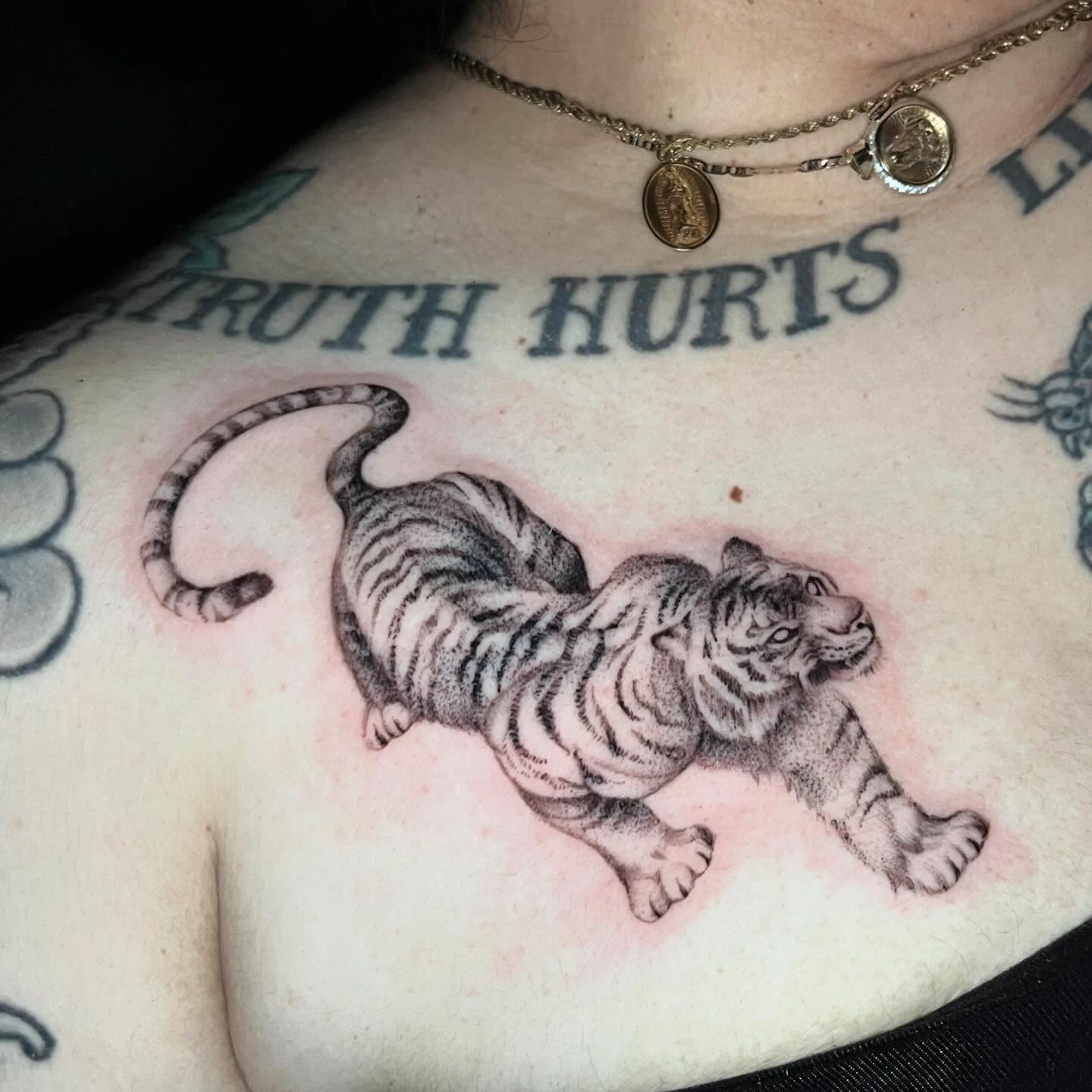 Tiger black and grey tattoo on the chest by Single Needle ๐ชฉ