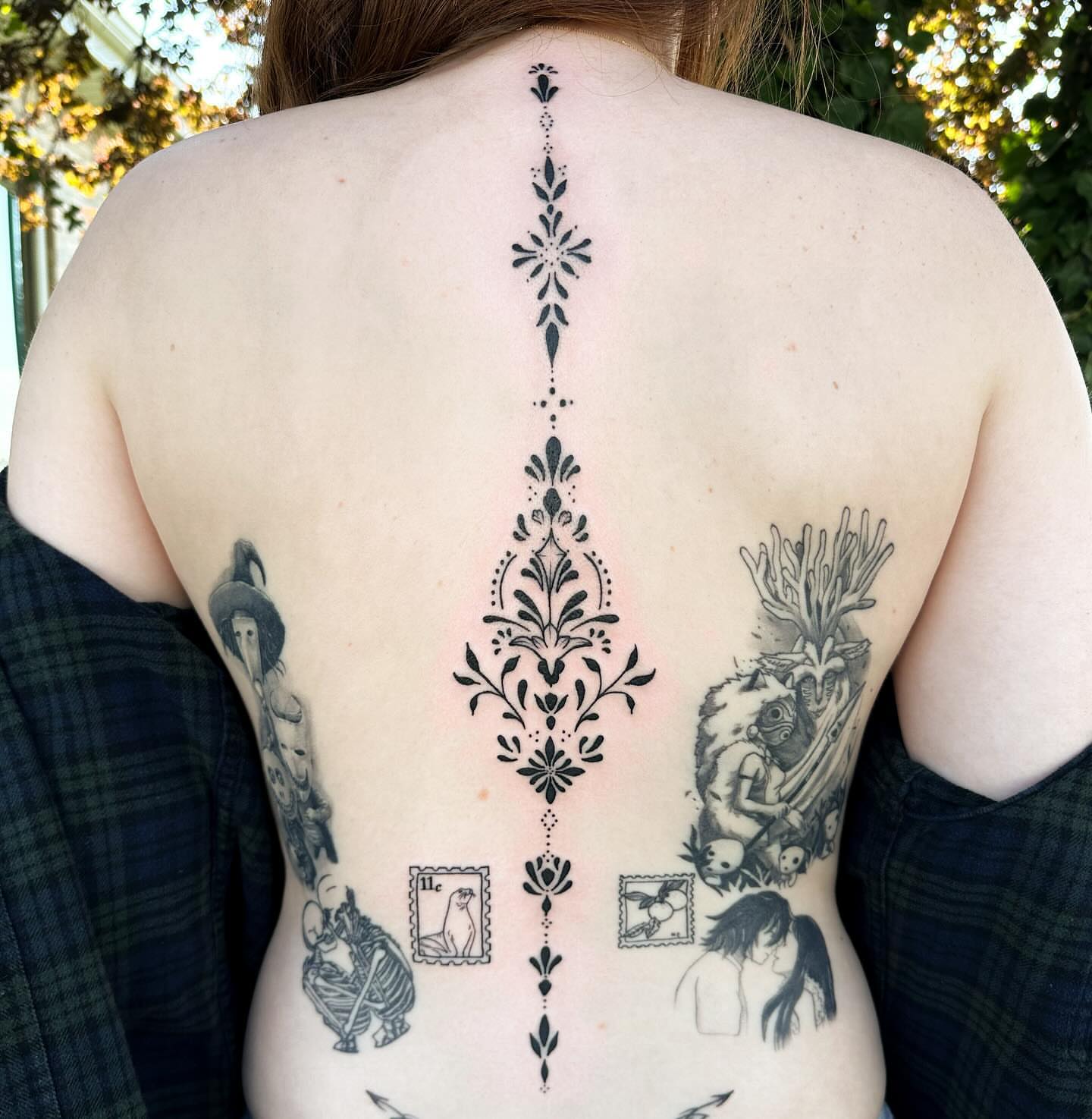 Floral ornamentation ornamental tattoo on the back by Gabby Tolley🌛