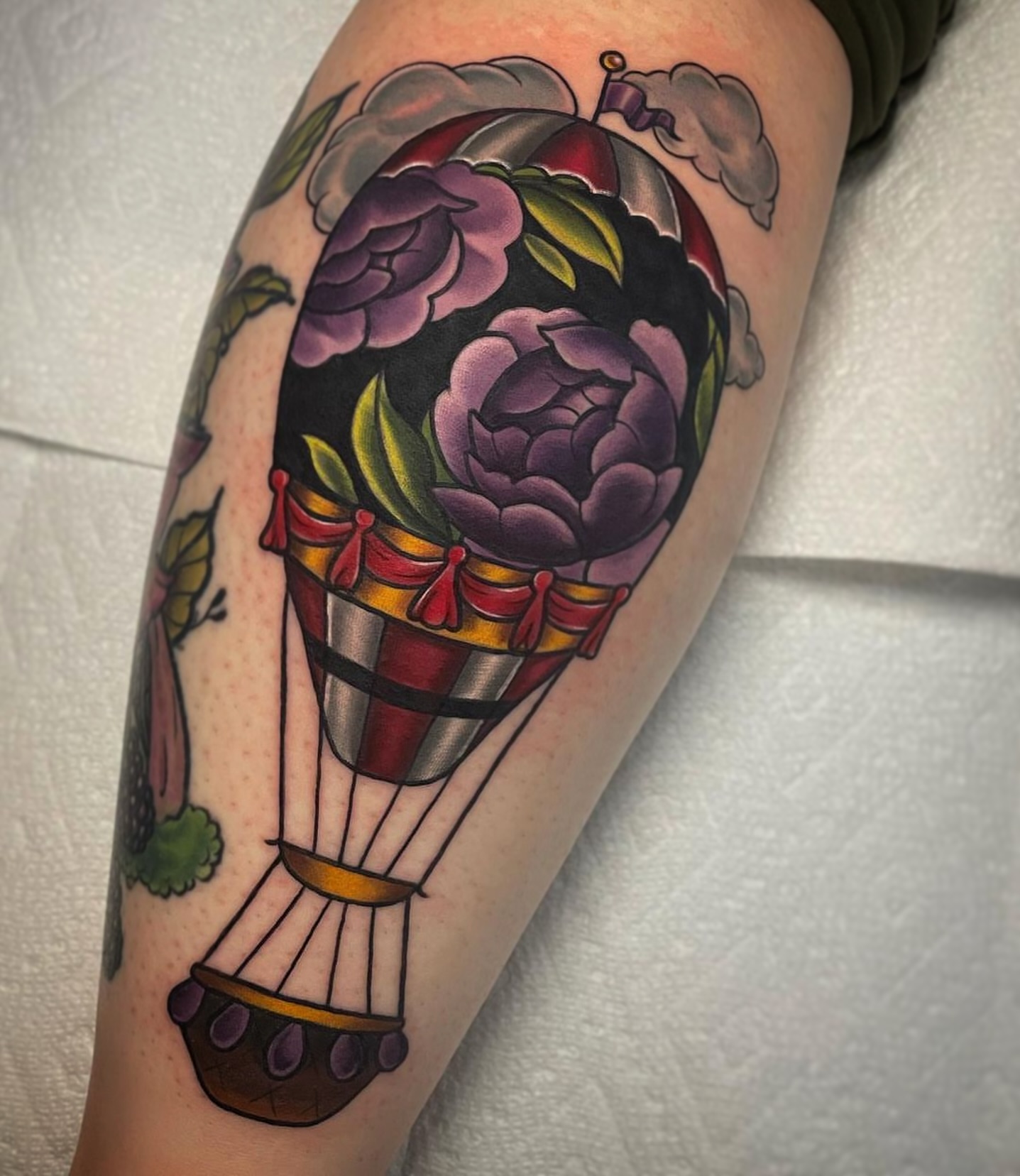 Hot air balloon with flowers American traditional tattoo on the forearm by ✨Sarah Knapp✨, Eugene, Oregon