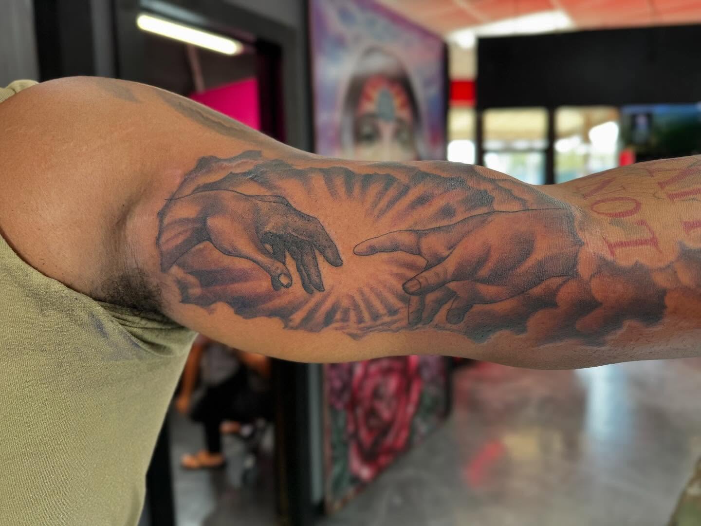 Creation scene realism tattoo on the forearm by Alejandro Zaragoza