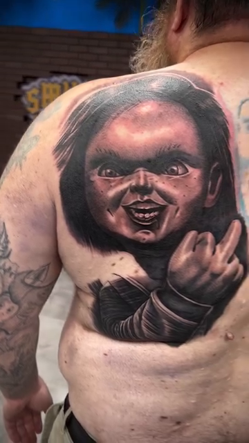 Chucky doll realism tattoo by Andrew Wine🍷Tattoo