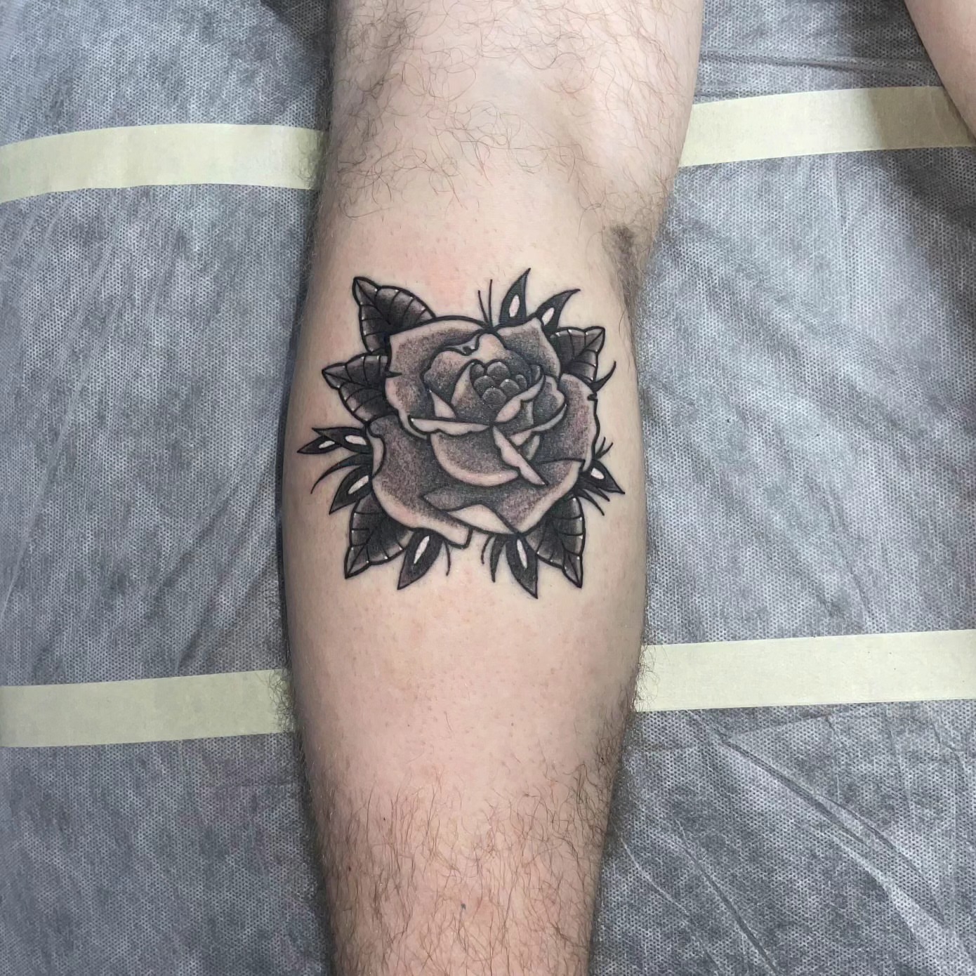 Rose black and grey tattoo on the forearm by Chaz Escobar