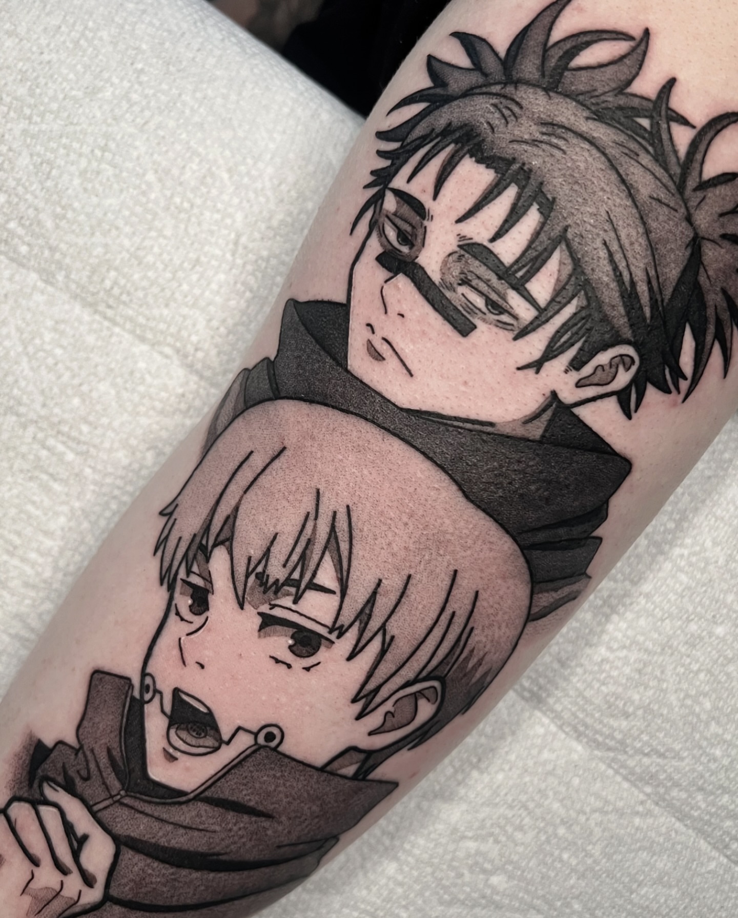 Anime characters anime tattoo on the forearm by Chandler Roe