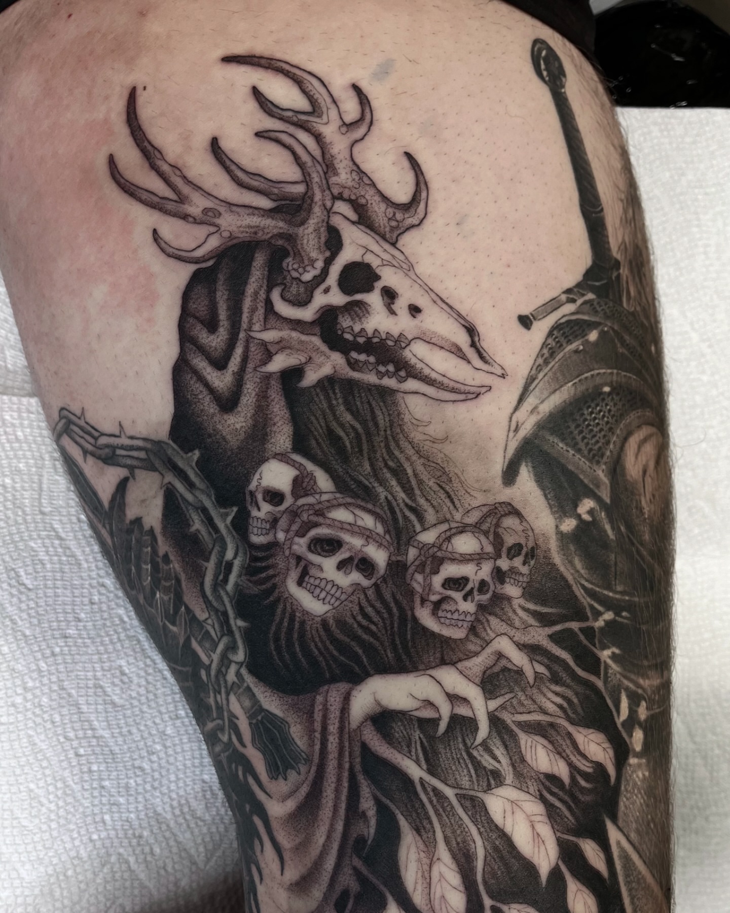 Deity with stag skull dark realism tattoo on the thigh by ๐๐๐๐๐๐๐