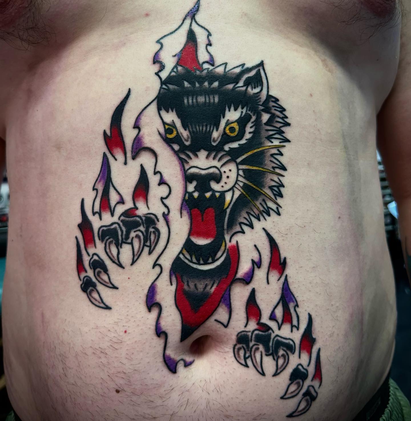 Wolf American traditional tattoo on the chest by Olive Kelley