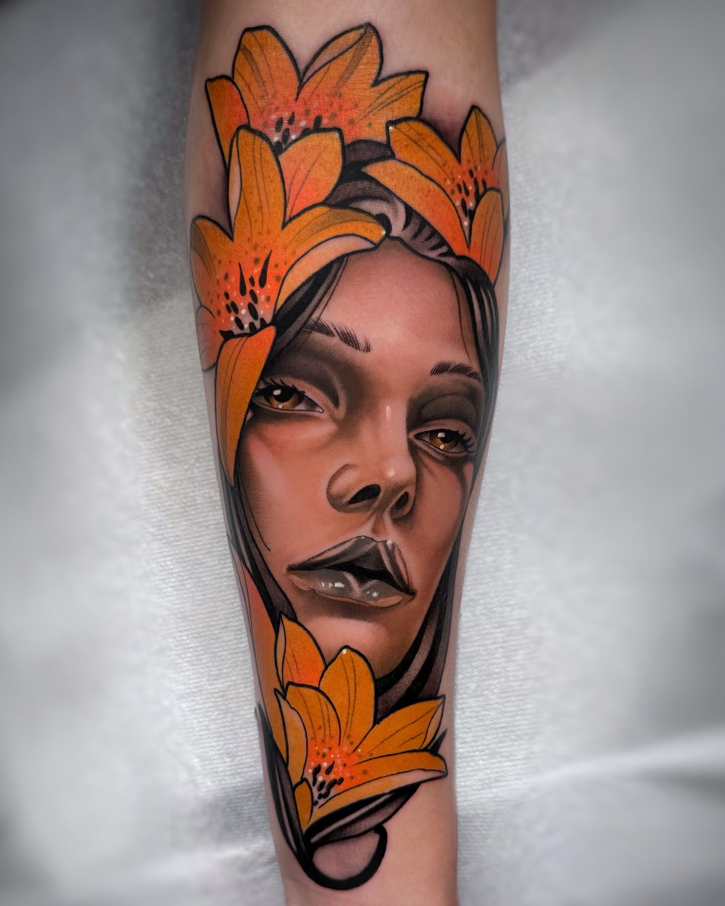 Woman with flowers realism tattoo on the forearm by Aitor Arie, Roseville, California