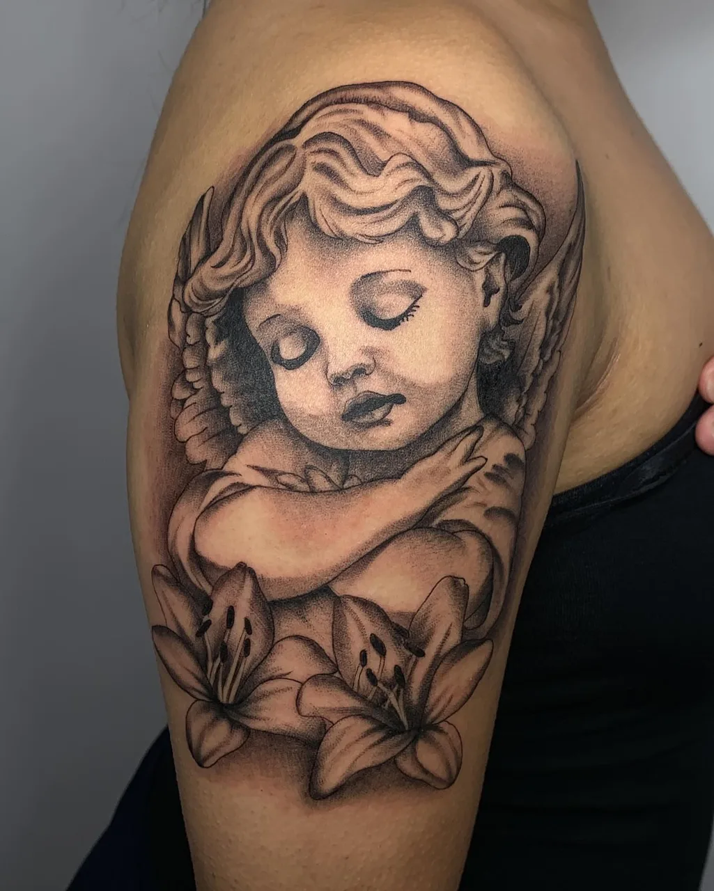 Angel with lilies realism tattoo on the shoulder by Savana ☆