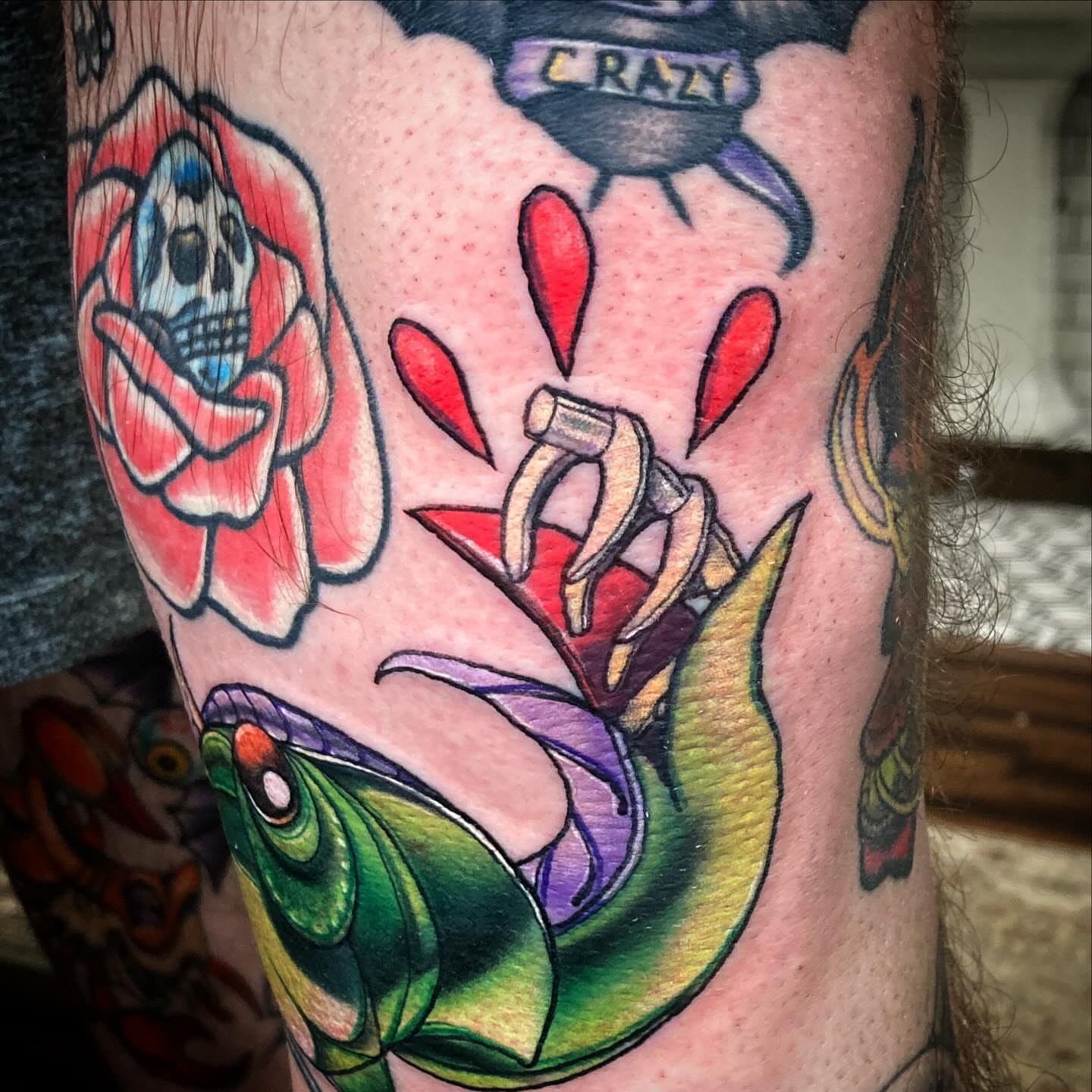 Rose with skull American traditional tattoo on the forearm by Bobby Trefz