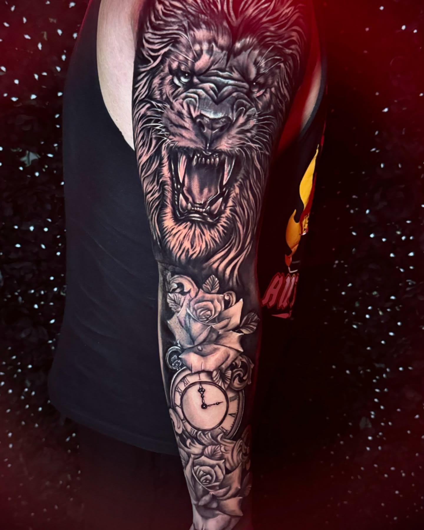 Roaring lion realism tattoo on the forearm by Tattoo Artist