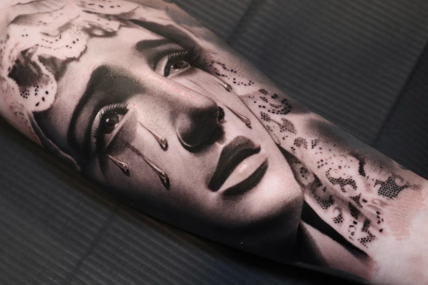 Woman's face realism tattoo on the forearm by Martin Reyes Jr