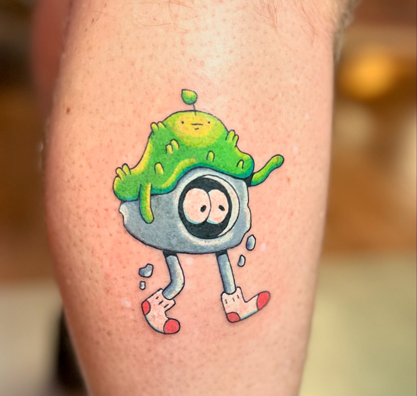 Alien character new school tattoo on the forearm by Kellie Burch