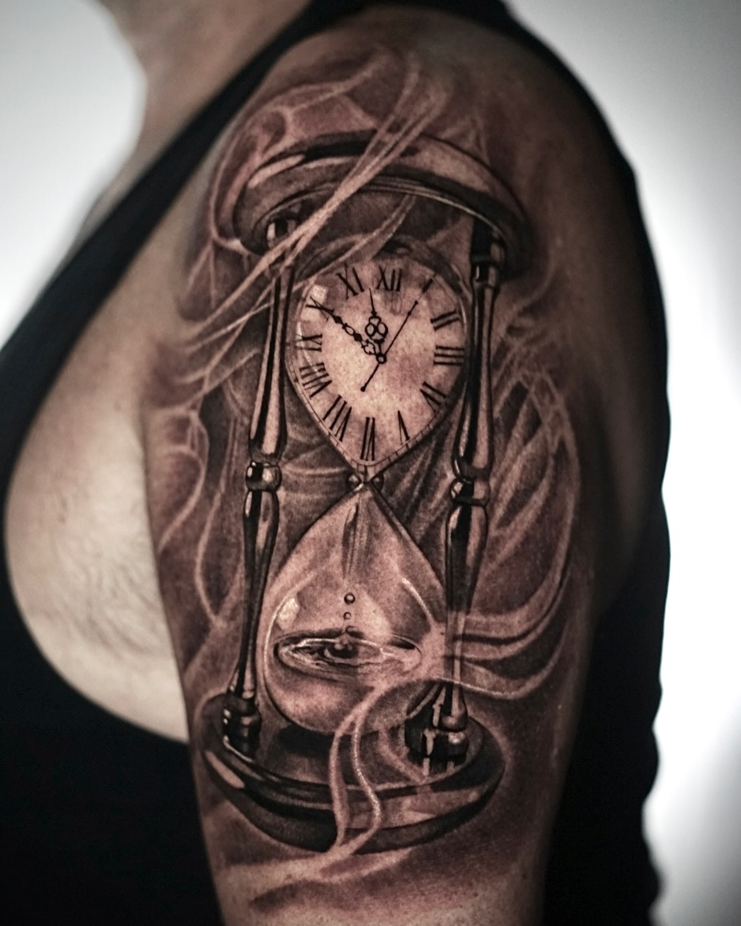 Hourglass clock realism tattoo on the shoulder by Sabrina Lakhaysy, Fort Worth, Texas