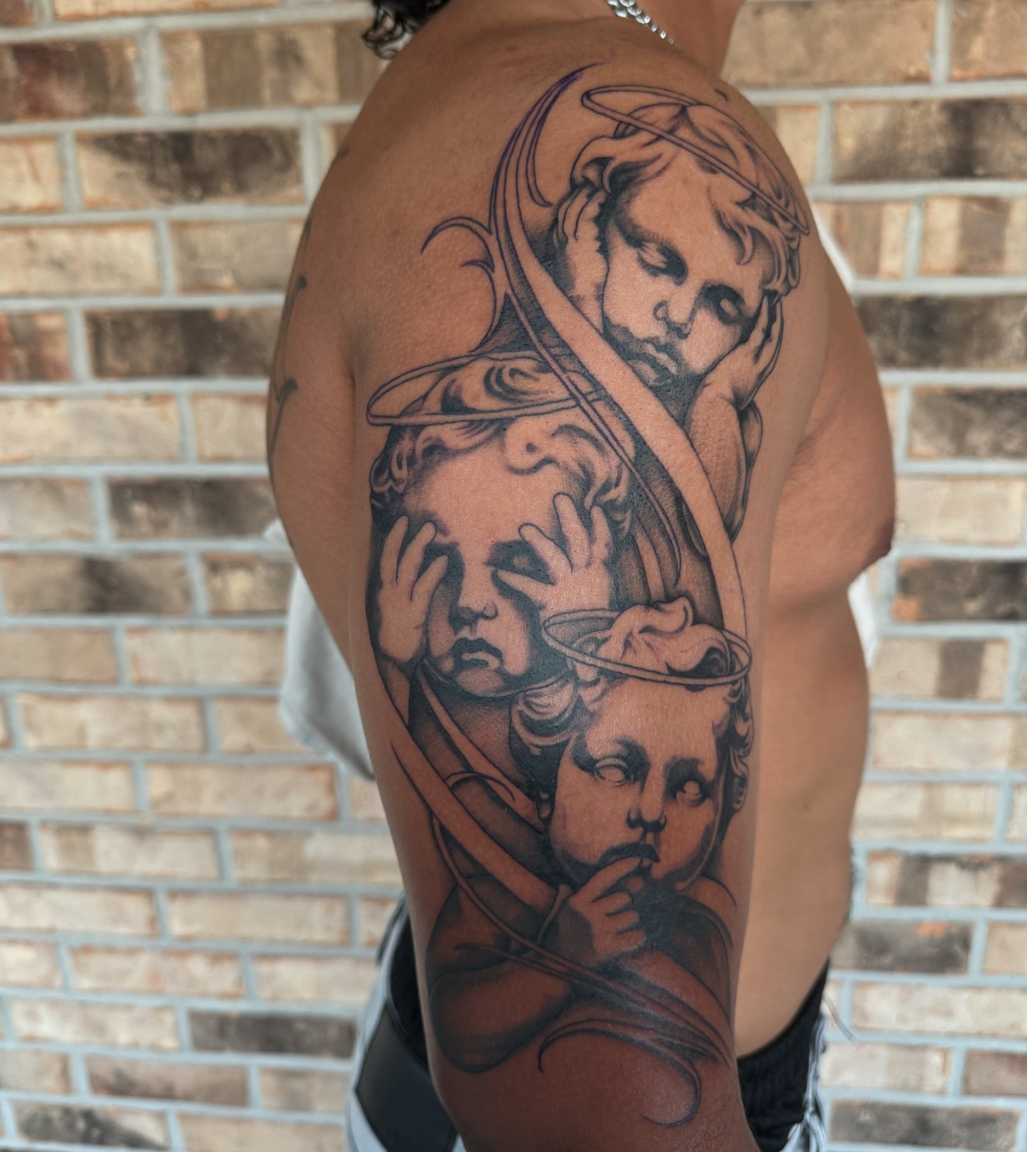 Religious figures realism tattoo on the shoulder by Storm