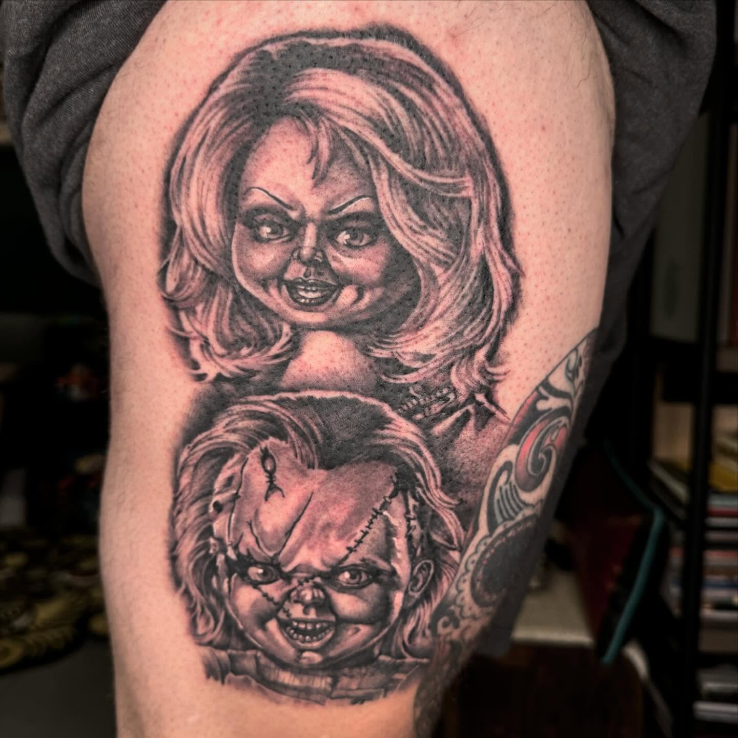 Chucky realism tattoo on the thigh by Ryan Futterman