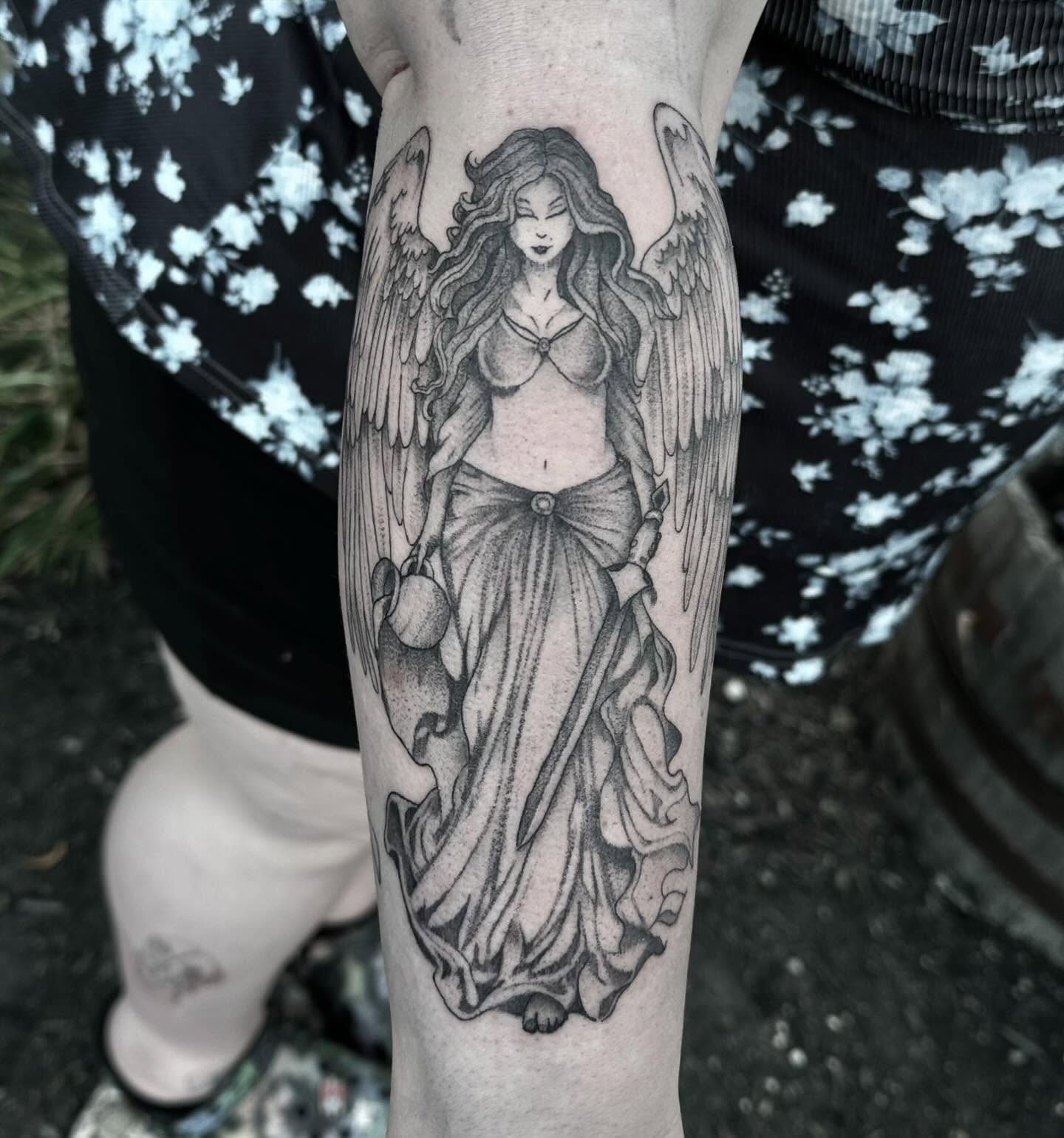 Angel black and grey tattoo on the forearm by Emmy