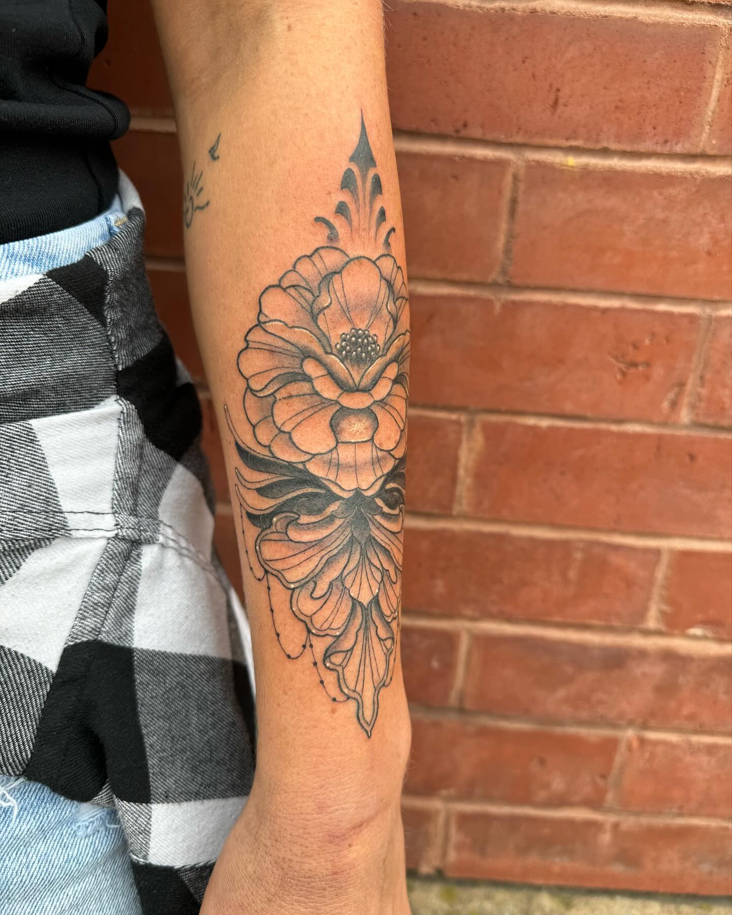 Flower black and grey tattoo on the forearm by Auzzy the Ink Pirate, Mansfield, Ohio