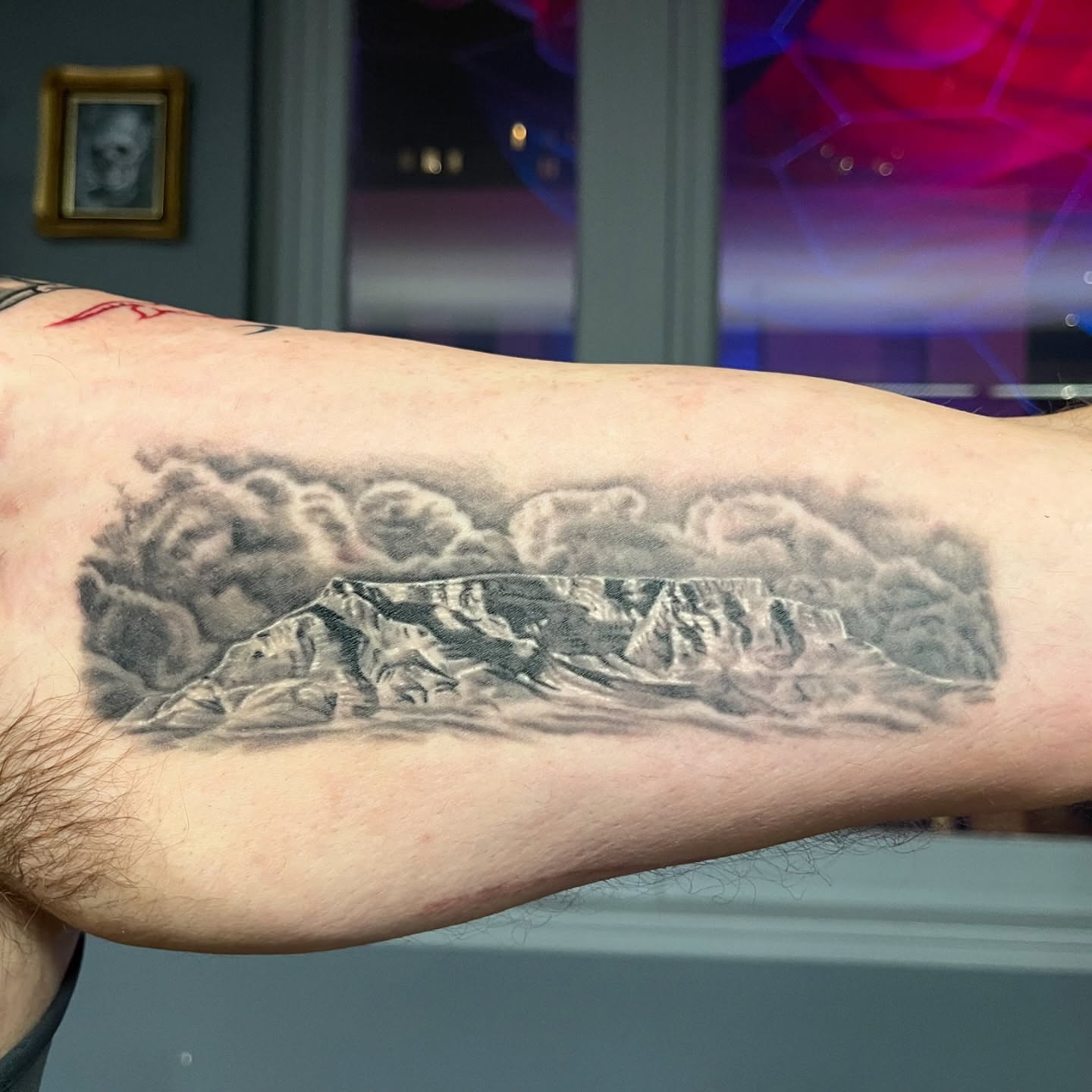 Mountain range black and grey tattoo on the forearm by Ohio Realism Tattoo Artist