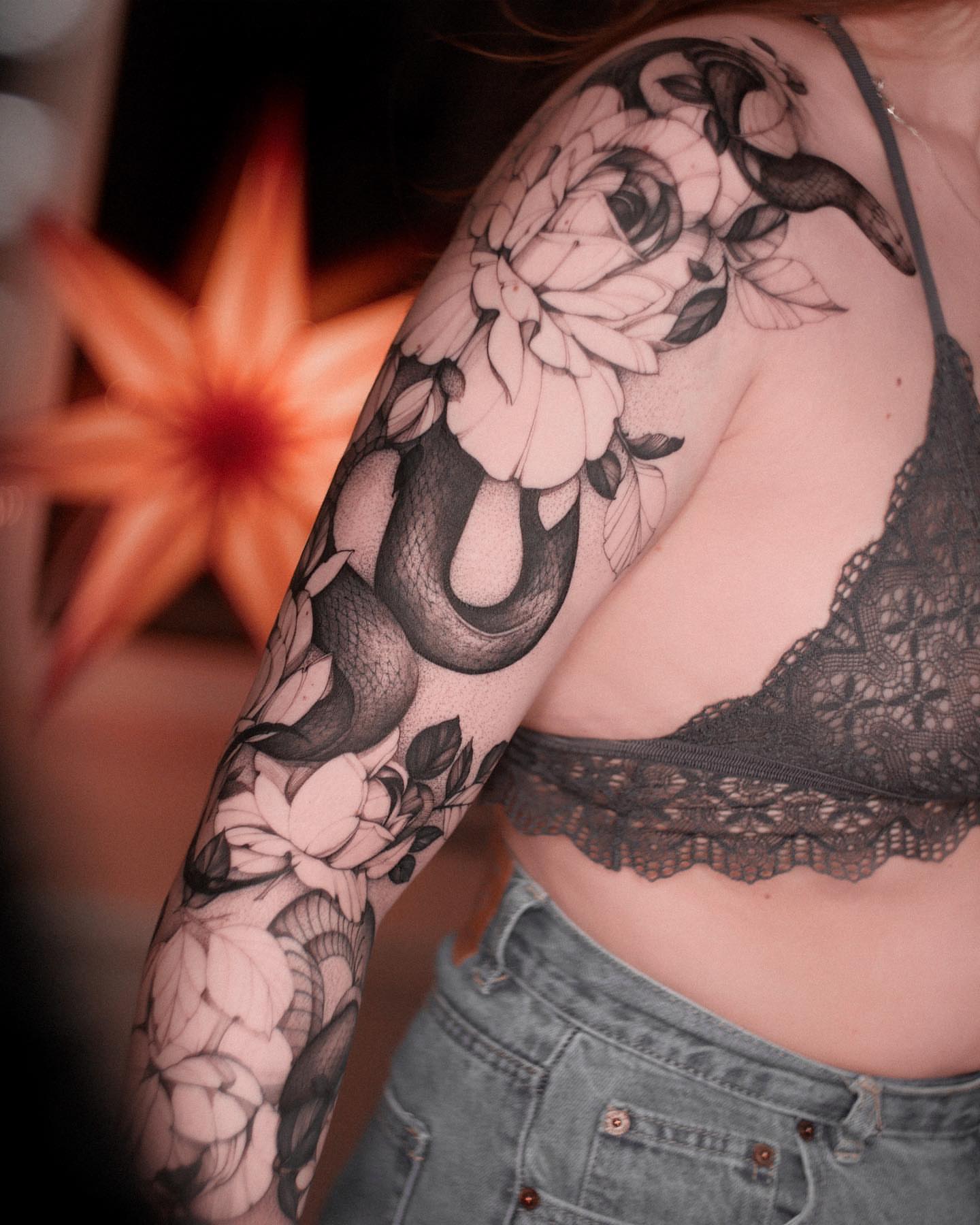 Snake and peony black and grey tattoo on the upper arm by Tattoo Seattle Anime Japanese San Francisco
