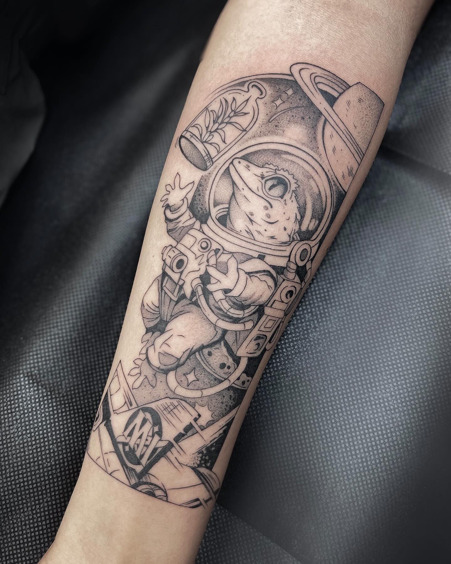 Astronaut dotwork tattoo on the forearm by Kelsi Steffensen