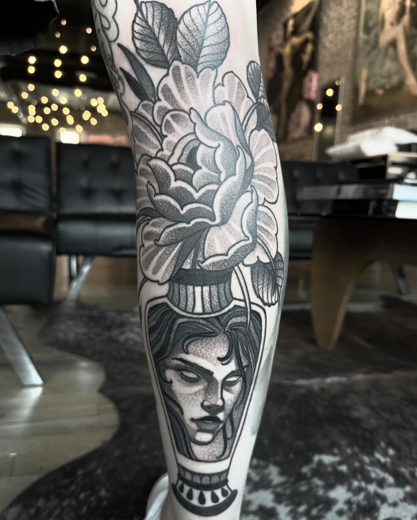 Woman with flowers dotwork tattoo on the forearm by Craig St Peter, Kansas City, Missouri